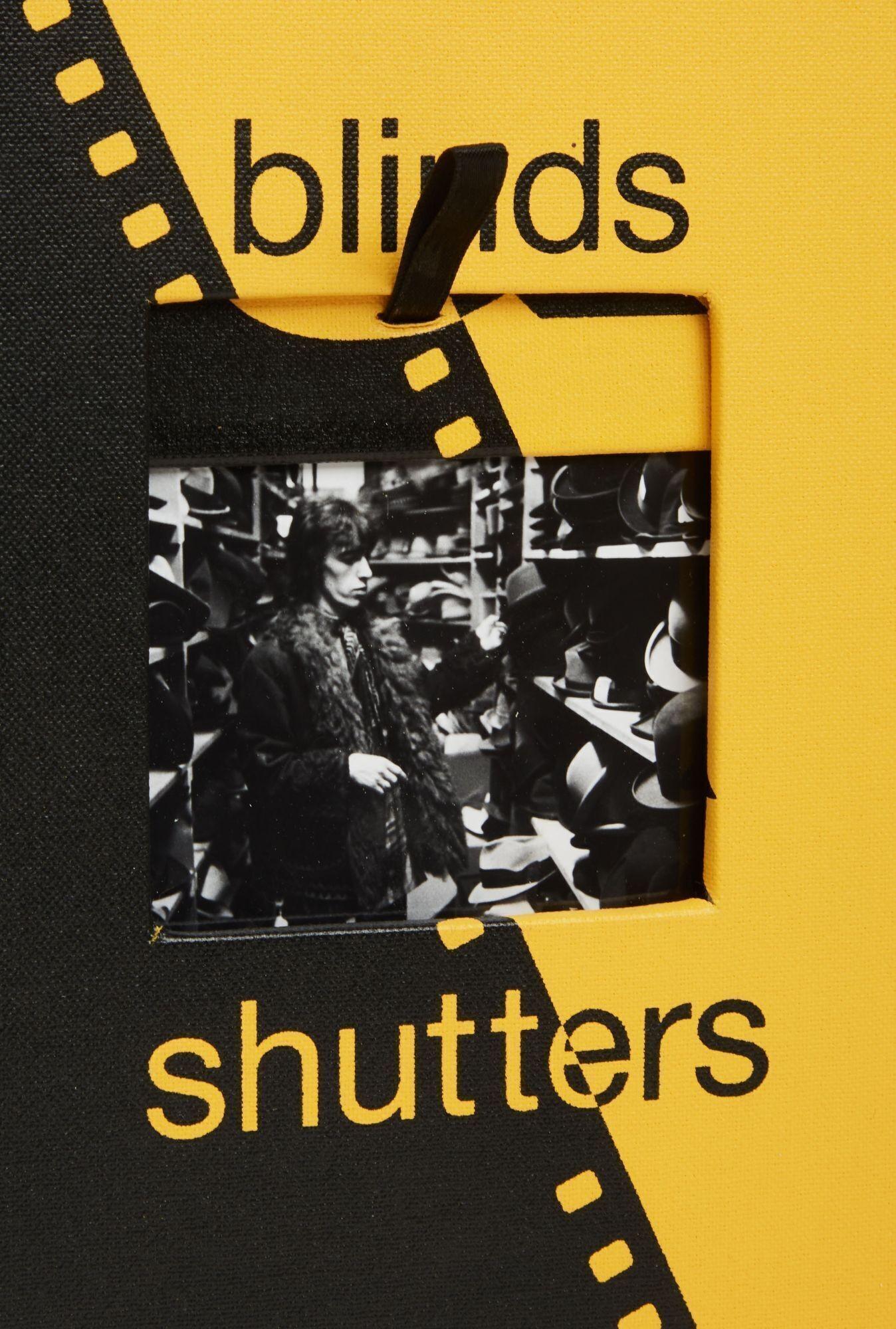 a black and yellow poster for blinds shutters
