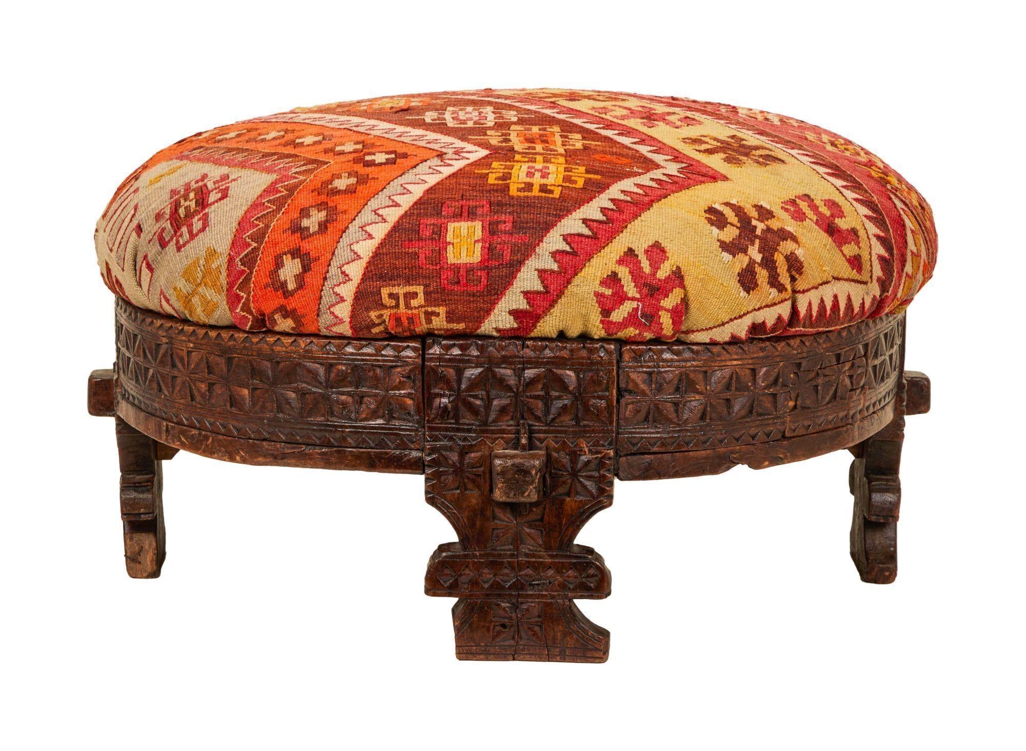 a colorful ottoman with a geometric pattern on it