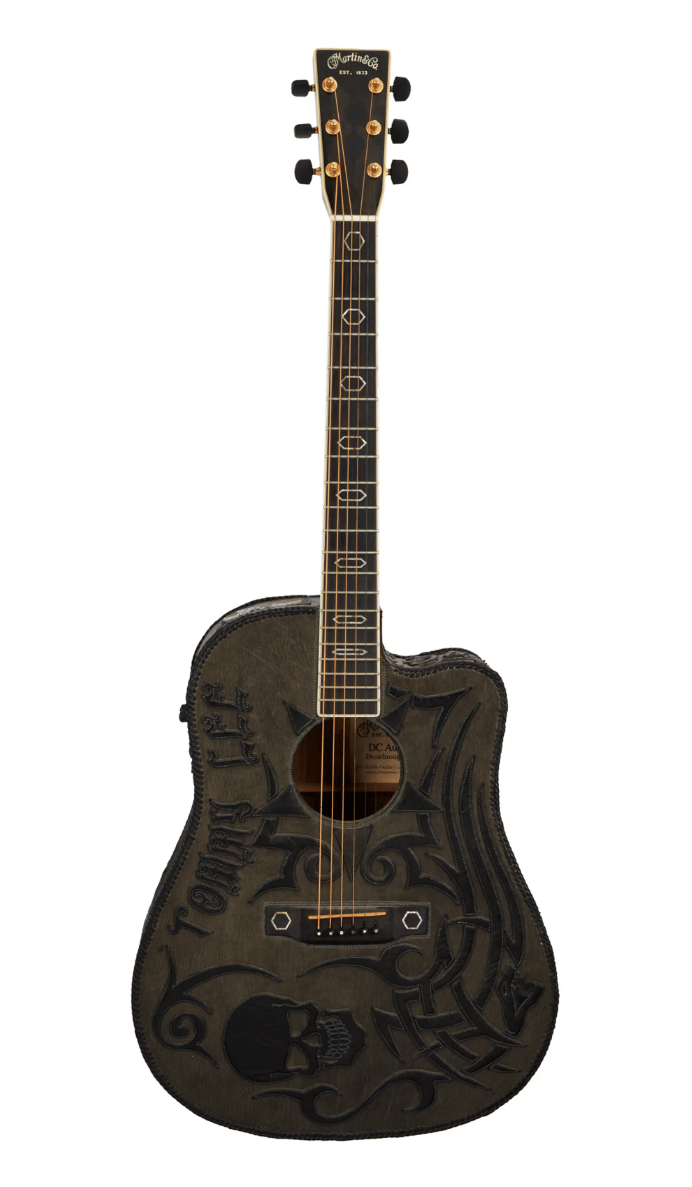 Lot #545. Tommy Lee | Martin DC Aura Dreadnought Acoustic Guitar with Custom Leather Wrap Lot #545 Tommy Lee Martin DC Aura Dreadnought Acoustic Guitar with Custom Leather Wrap