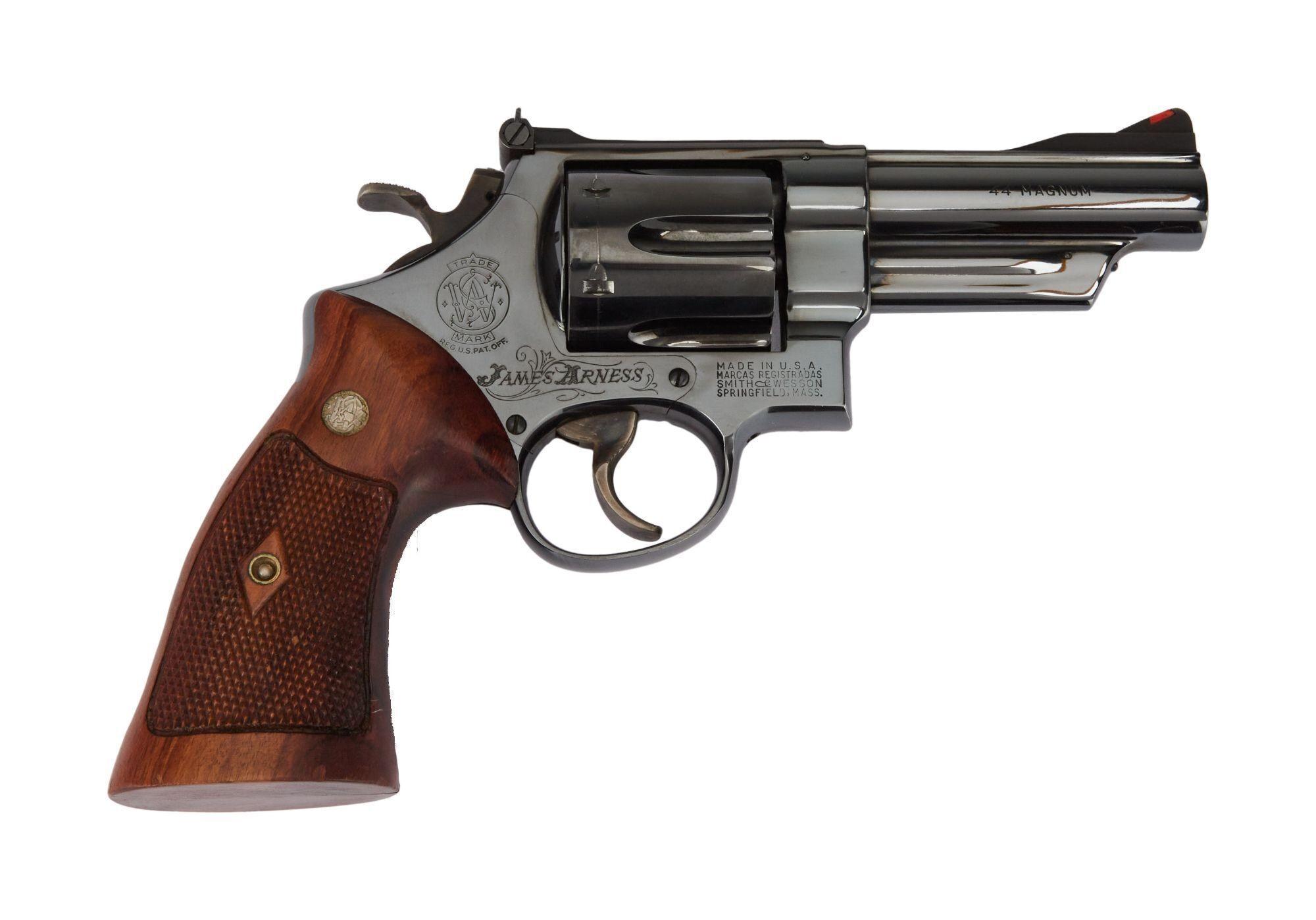 a smith & wesson revolver with a wooden grip on a white background .