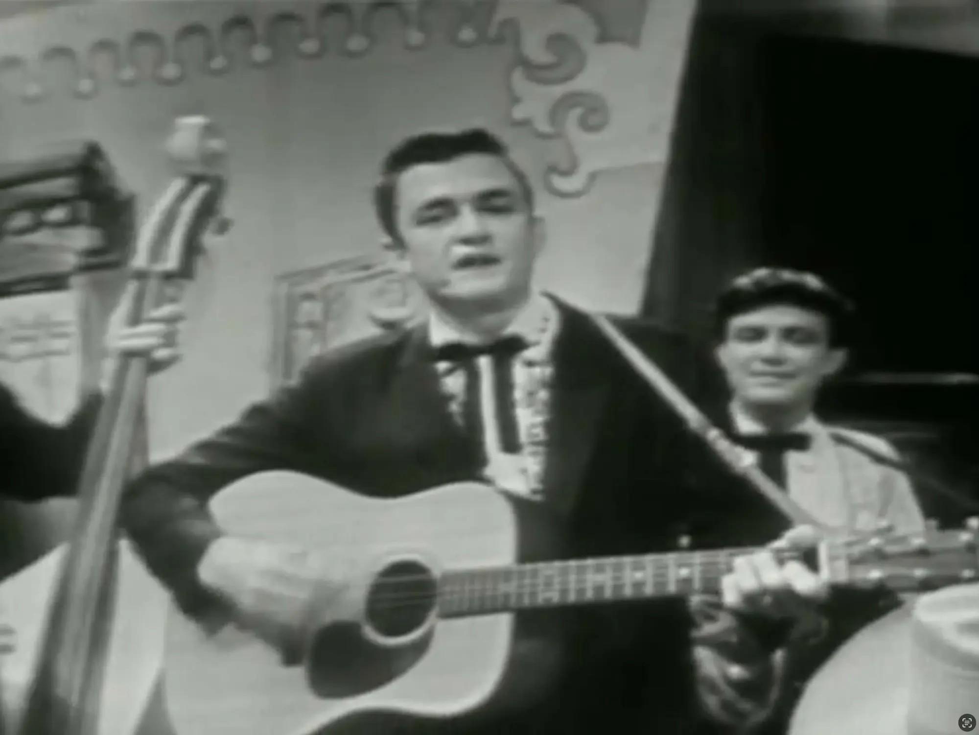 Lot #24 Johnny Cash Grand Ole Opry 1956 Debut Stage Played 1954 Martin D18 Acoustic Guitar black and white photo