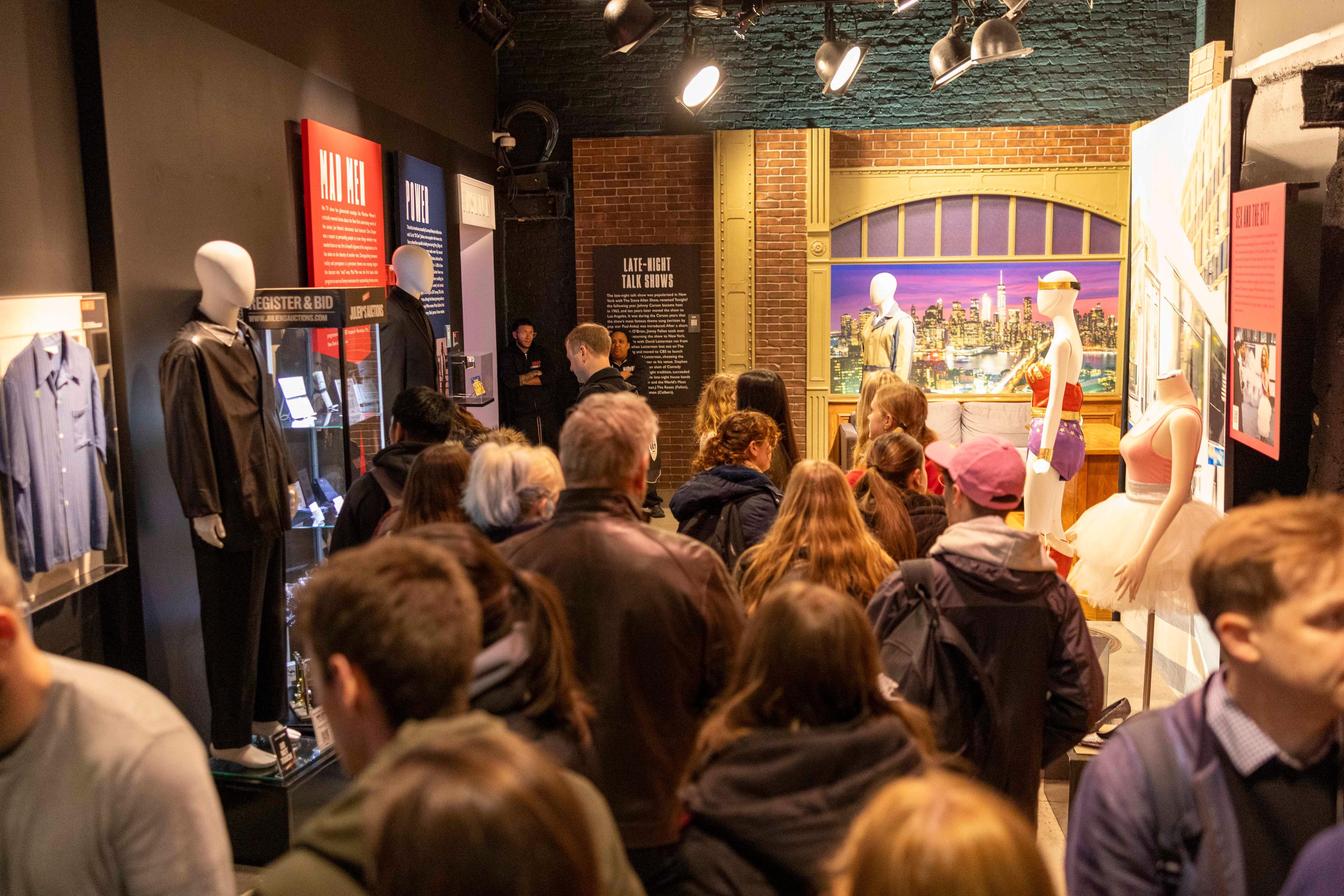 attendees visit a julien's auctions exhibition