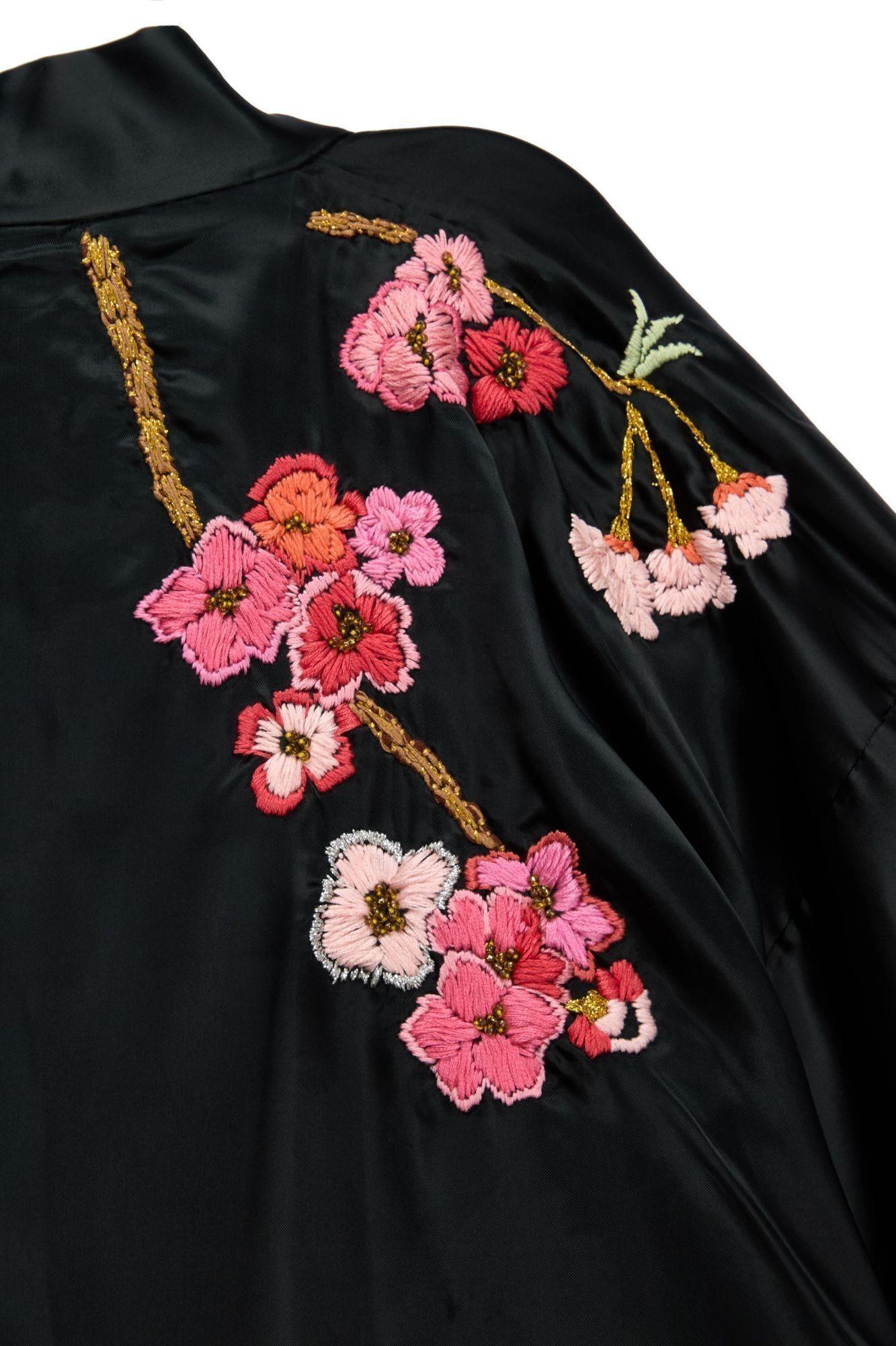Lot #49. Freddie Mercury | Personally Owned Kimono a black jacket with embroidered flowers on the back