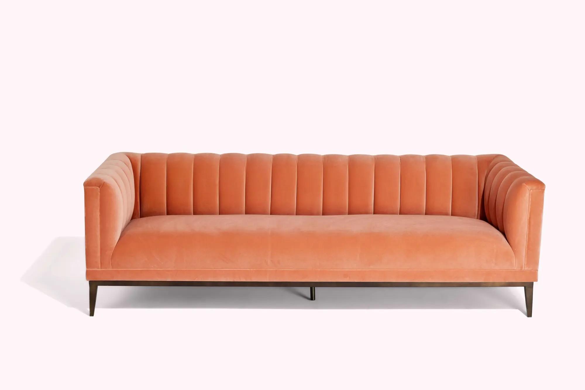 Lot #481. And Just Like That… | Miranda Hobbes's Velvet Coral Sofa Lot #481 And Just Like That… Miranda Hobbes's Velvet Coral Sofa