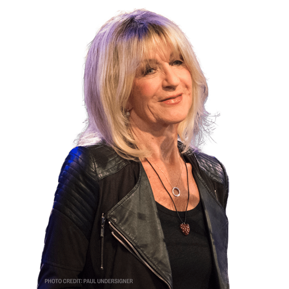 a woman wearing a leather jacket and a necklace with the photo credit paul undersigner