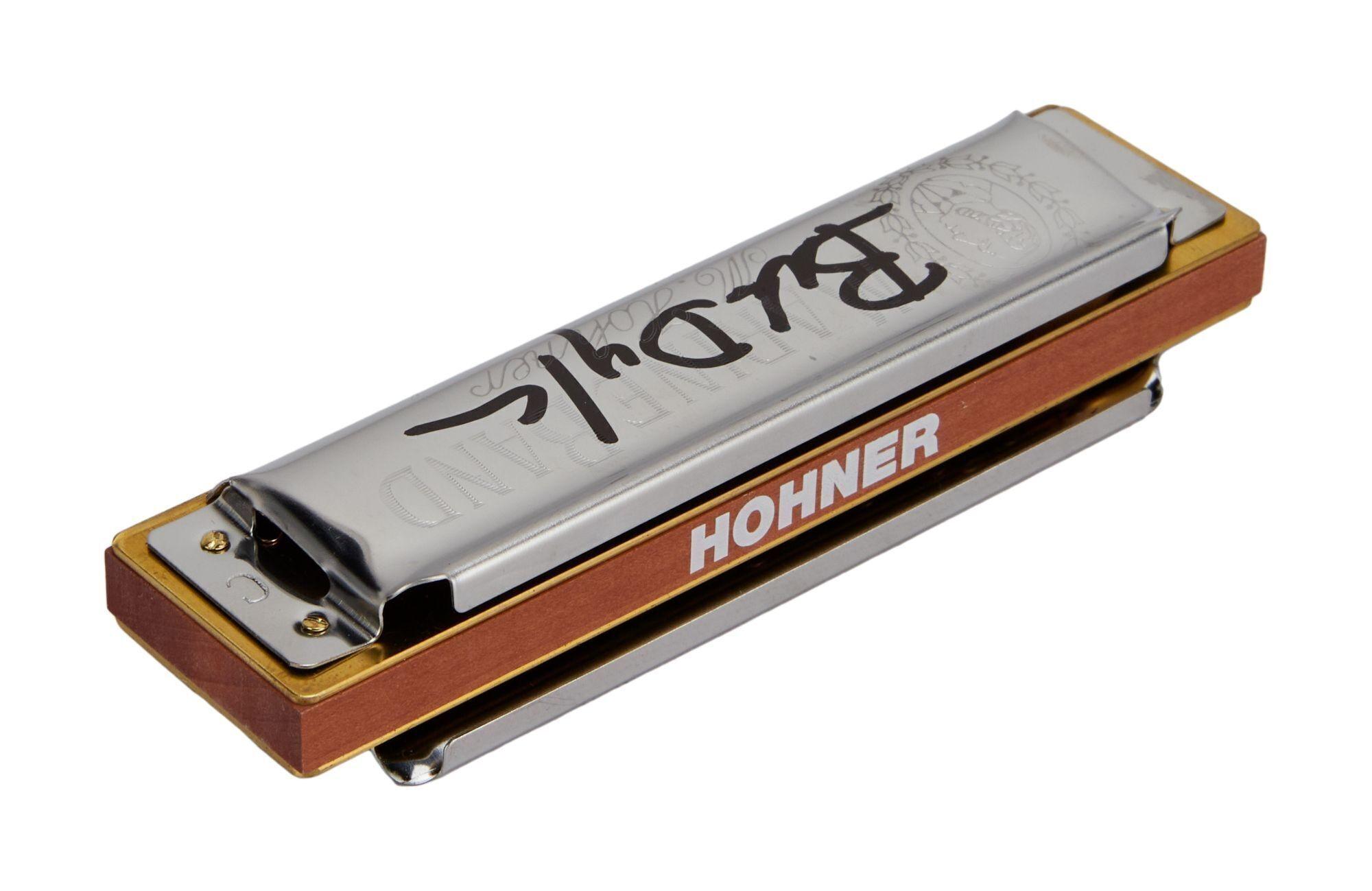 a hohner harmonica on a white background