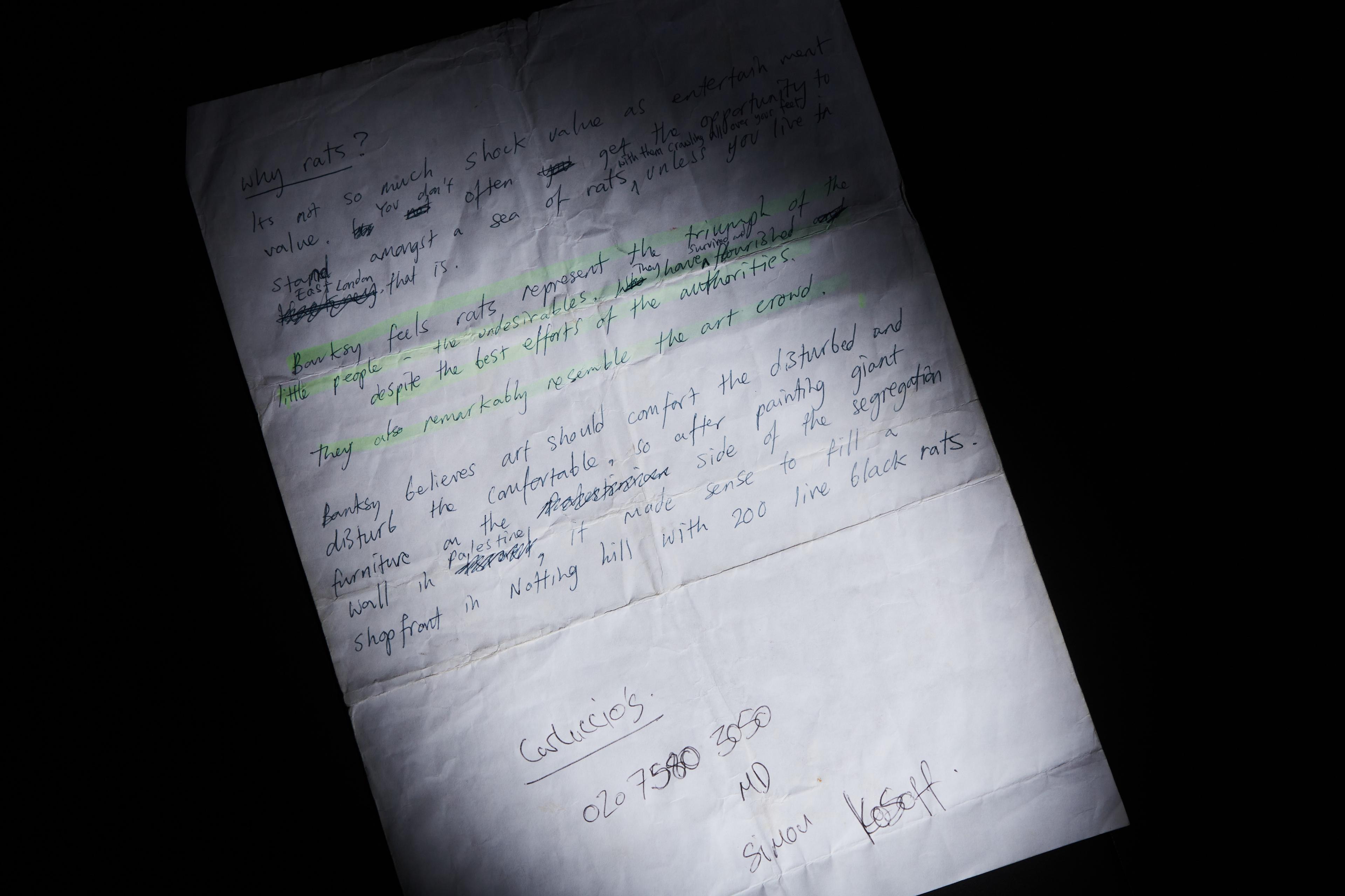 a close up of a piece of paper with handwriting on it .
