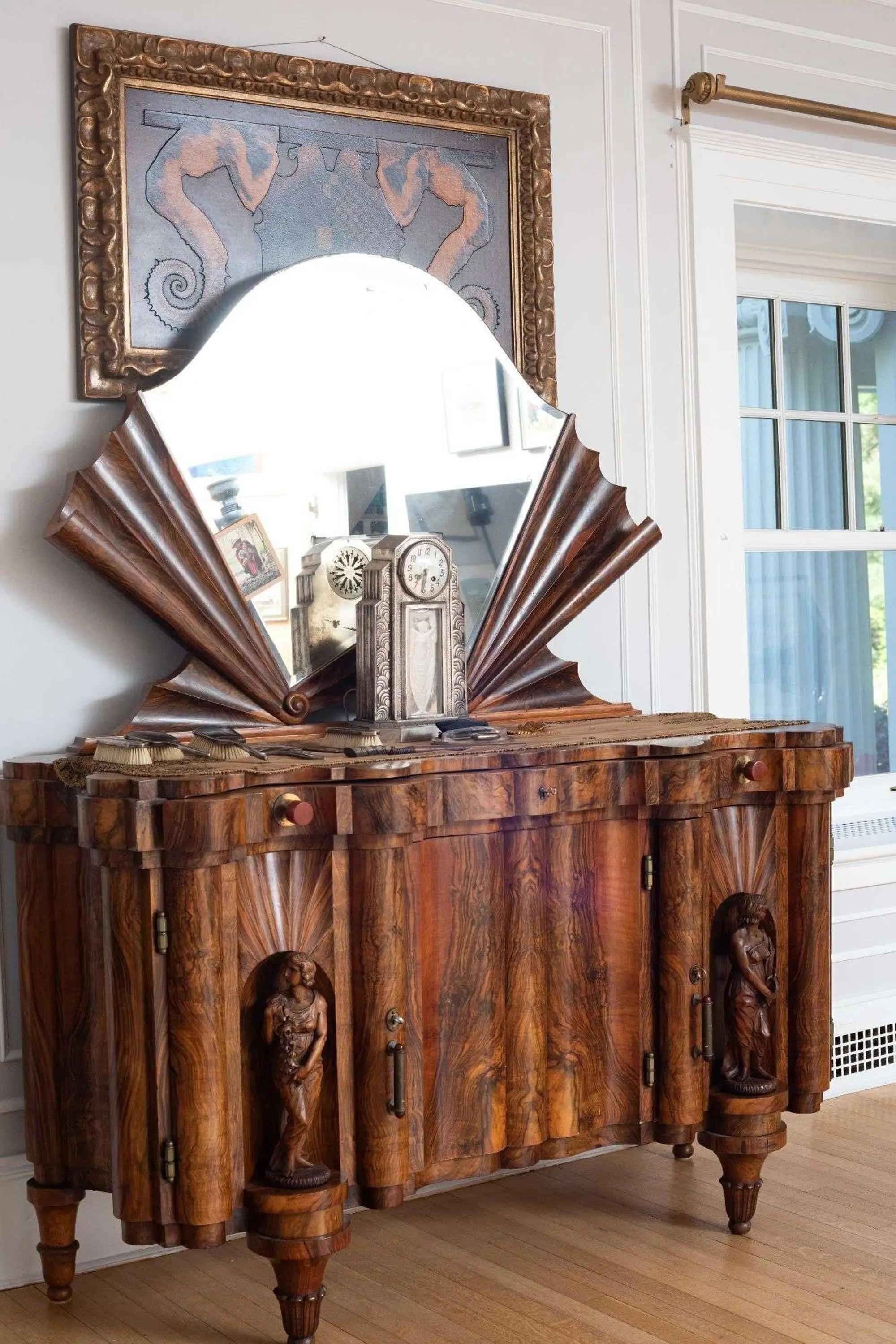 a side credenza with attached mirror