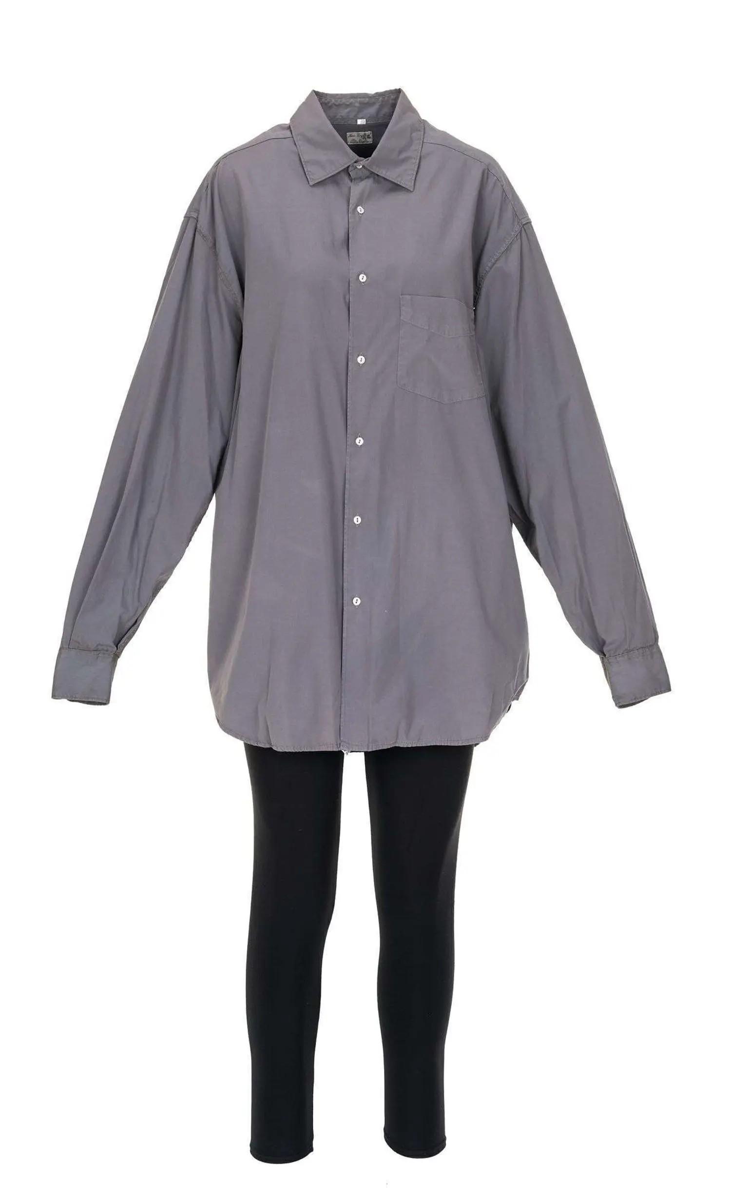 Grey oversized button-up shirt over black leggings.