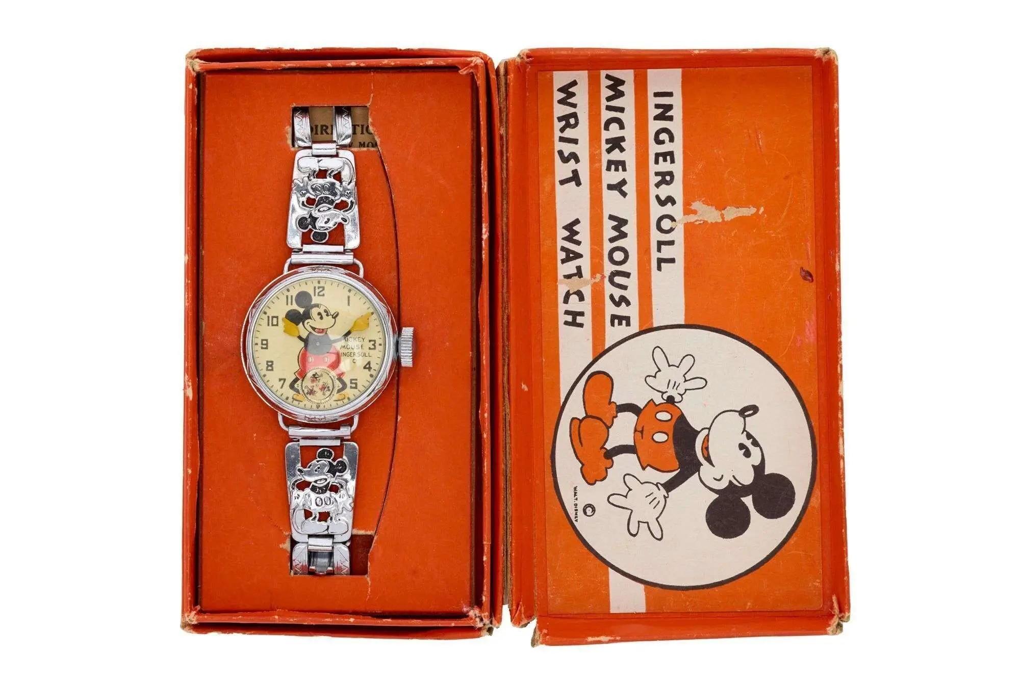 A vintage Ingersoll Mickey Mouse wrist watch in its original orange box.