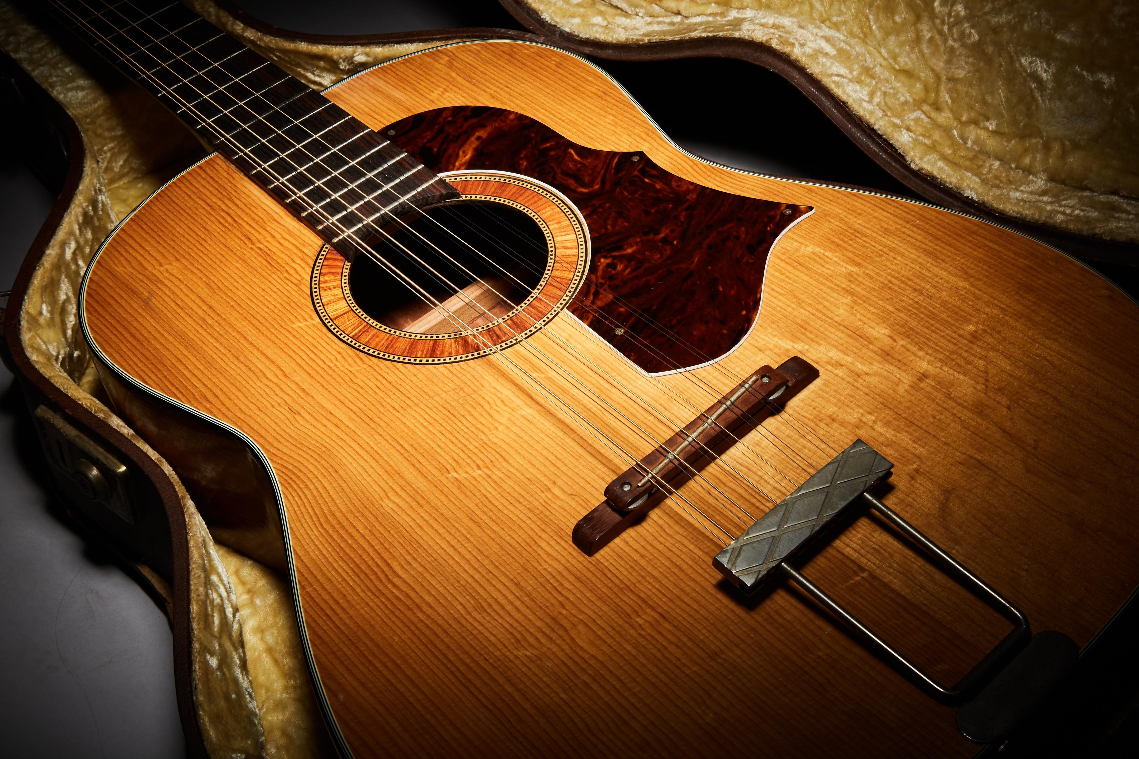 a close up of an acoustic guitar in a case .
