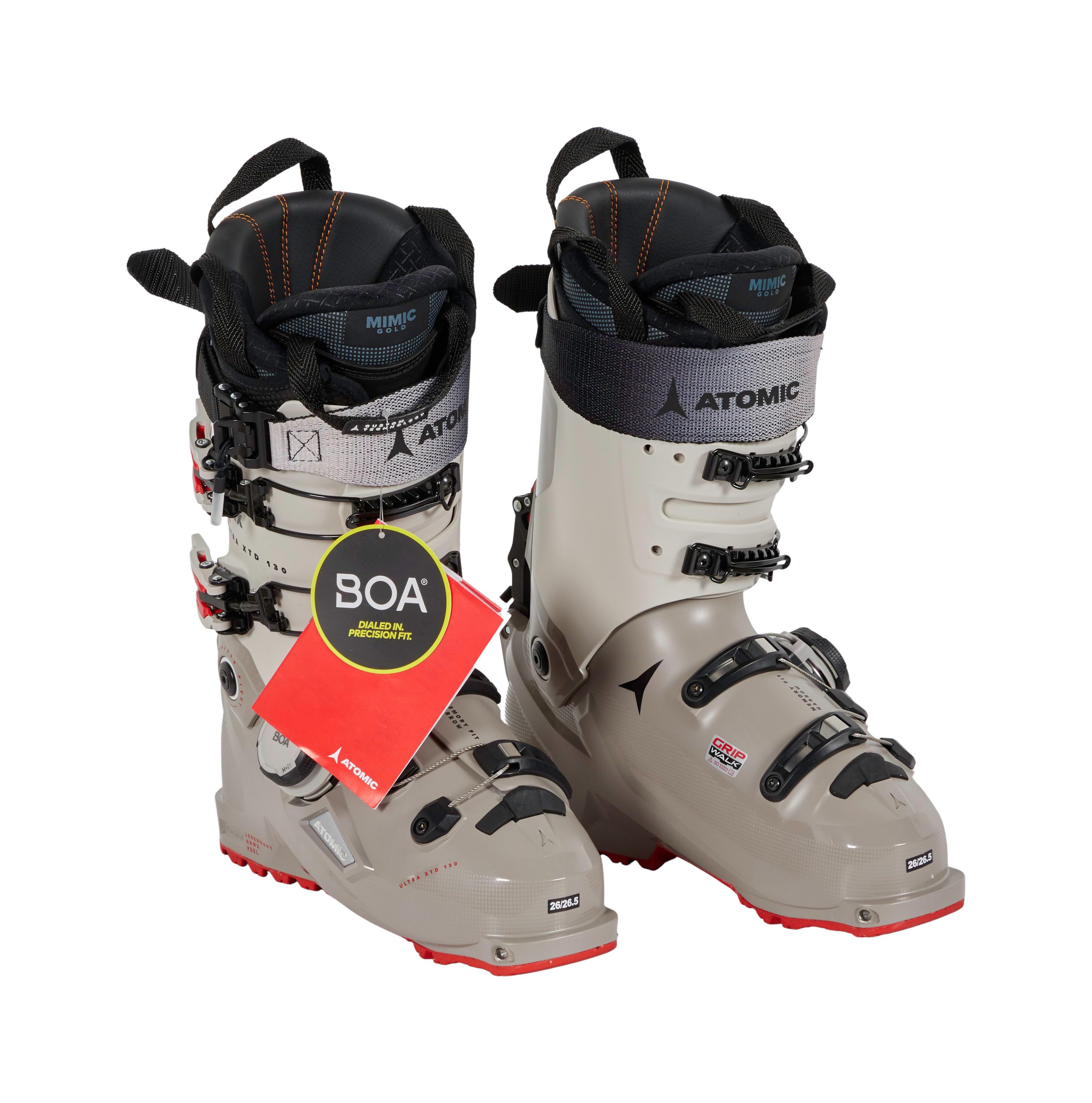 a pair of atomic ski boots on a white background