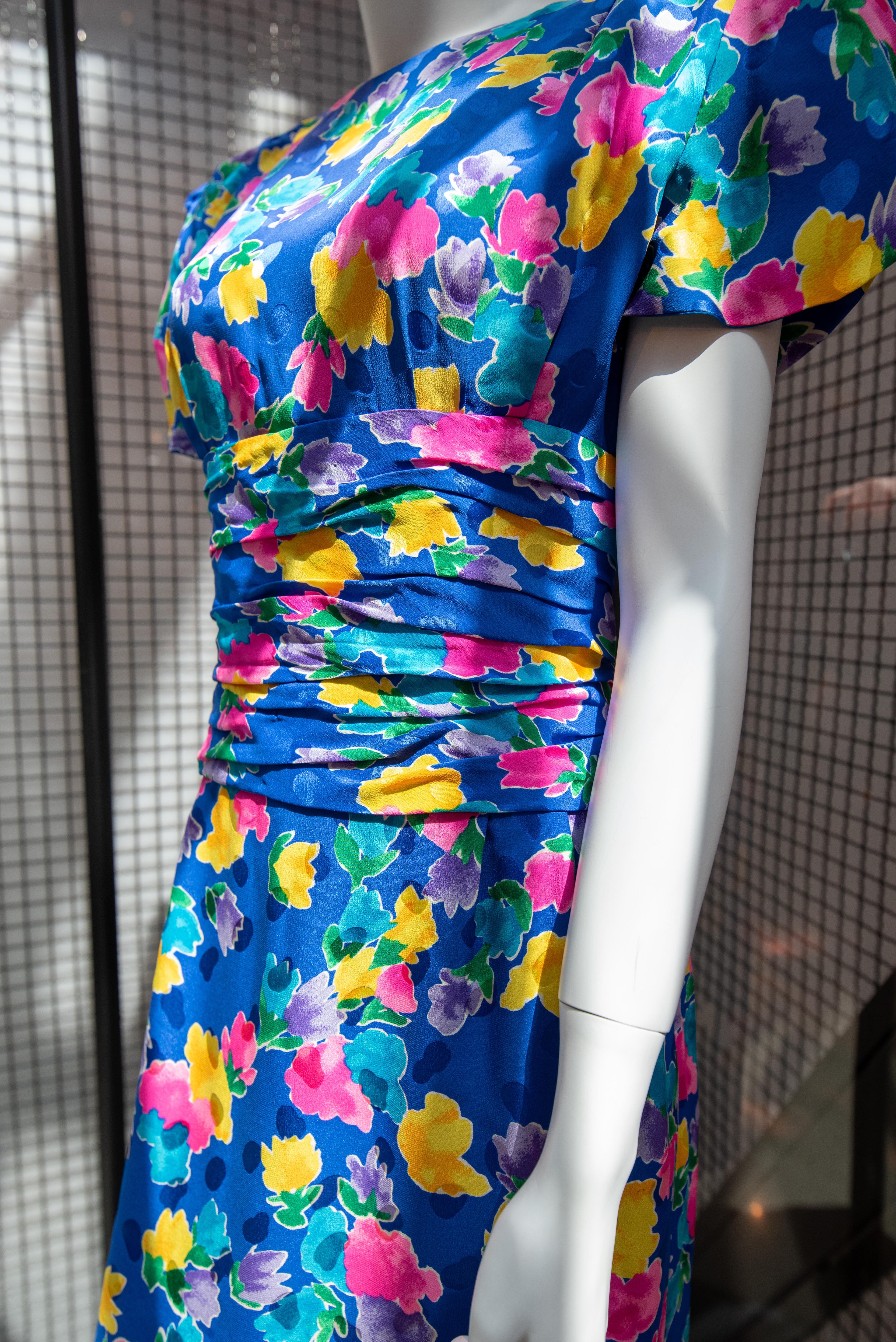 a close up of a blue flower dress