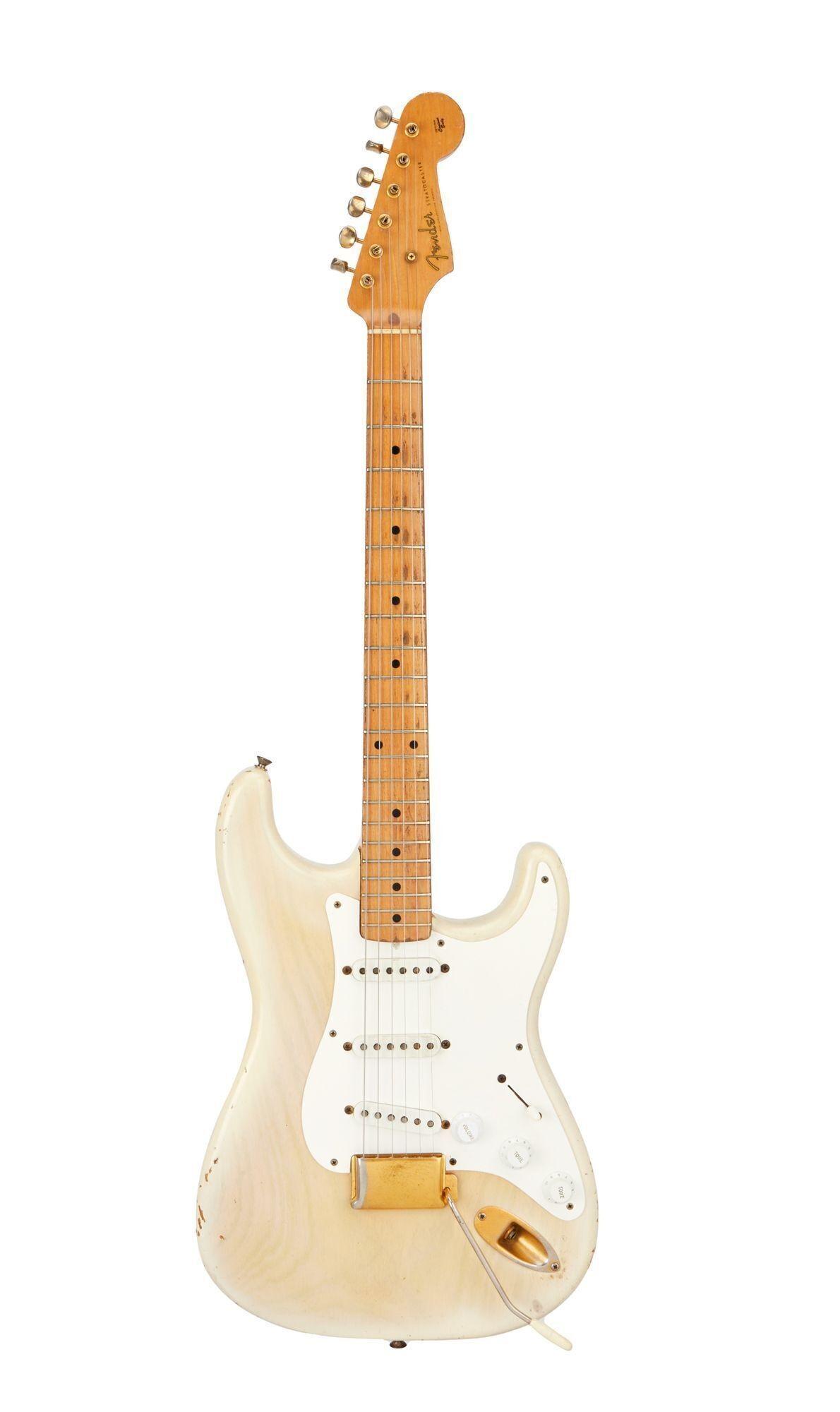 a white fender electric guitar on a white background