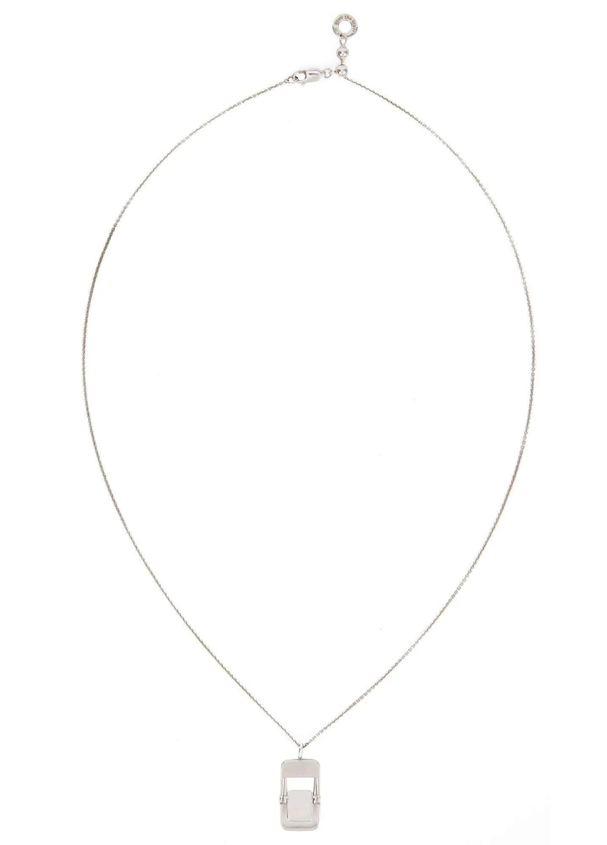 Lot #123. Whoopi Goldberg | 2000s “The View” Worn Pave The Way Sterling Silver And Diamond Folding Chair Pendant Necklace Silver necklace with a rectangular pendant and an interior horizontal bar.