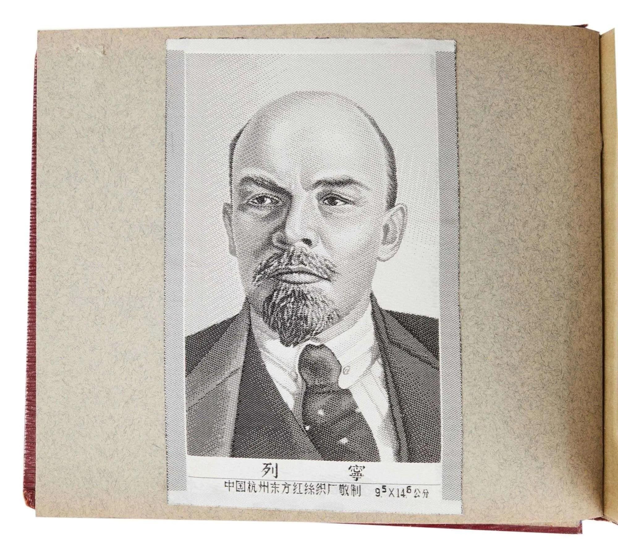 Grayscale portrait of Lenin in an open album.