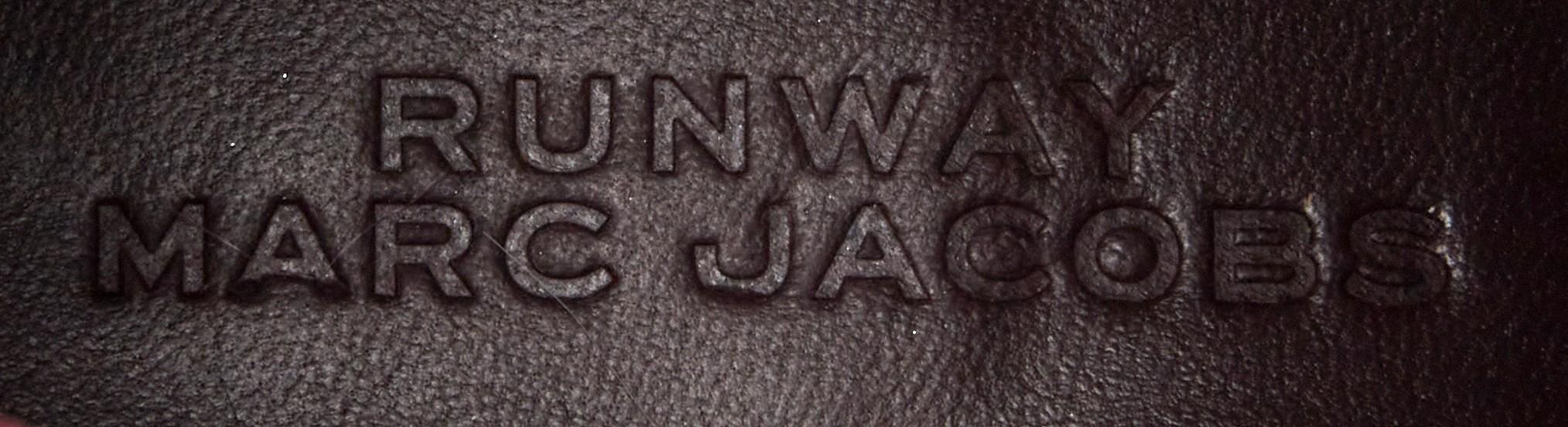 a close up of a runway marc jacobs logo