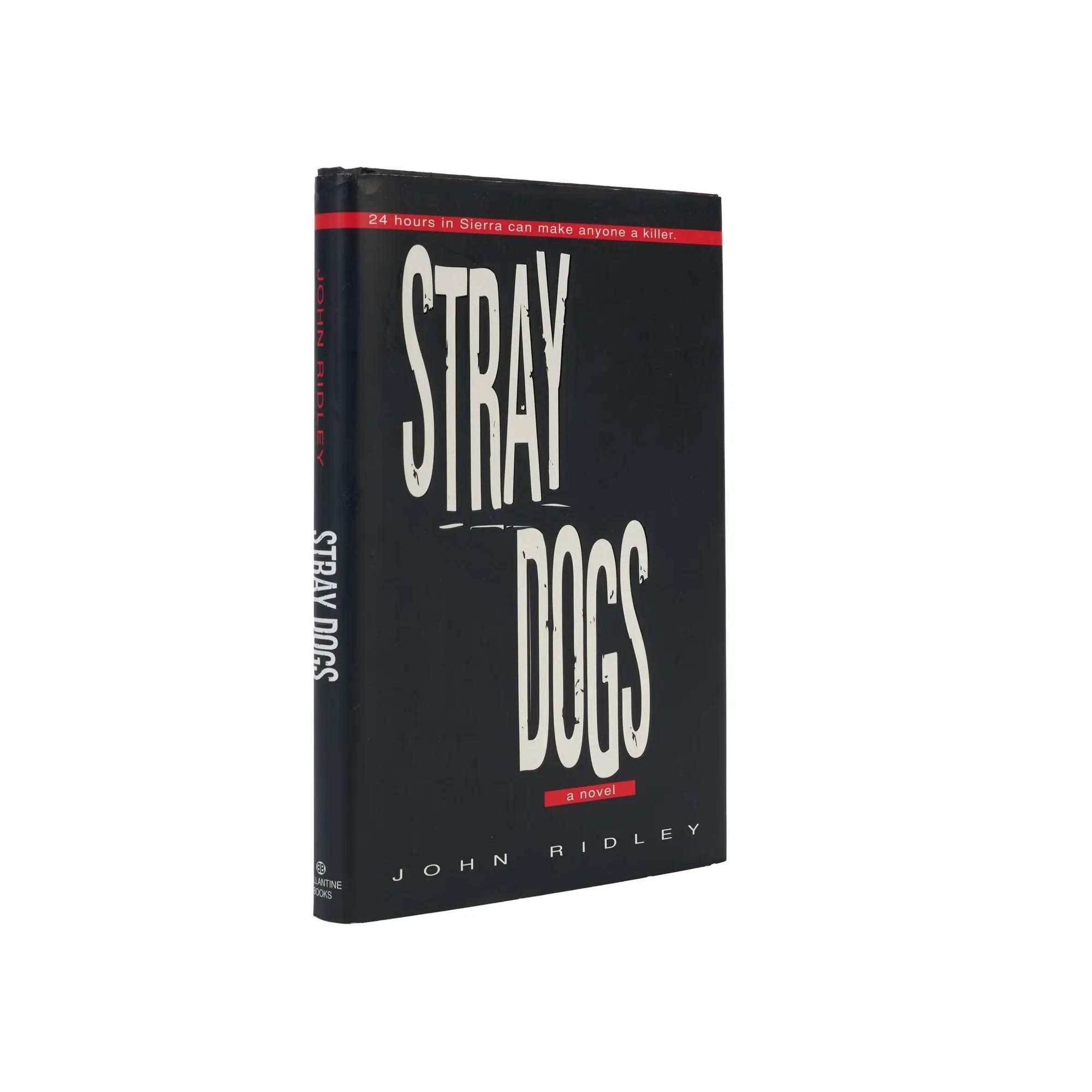 Lot #285  Stray Dogs First Edition Signed by Nick Nolte, Oliver Stone, and John Ridley