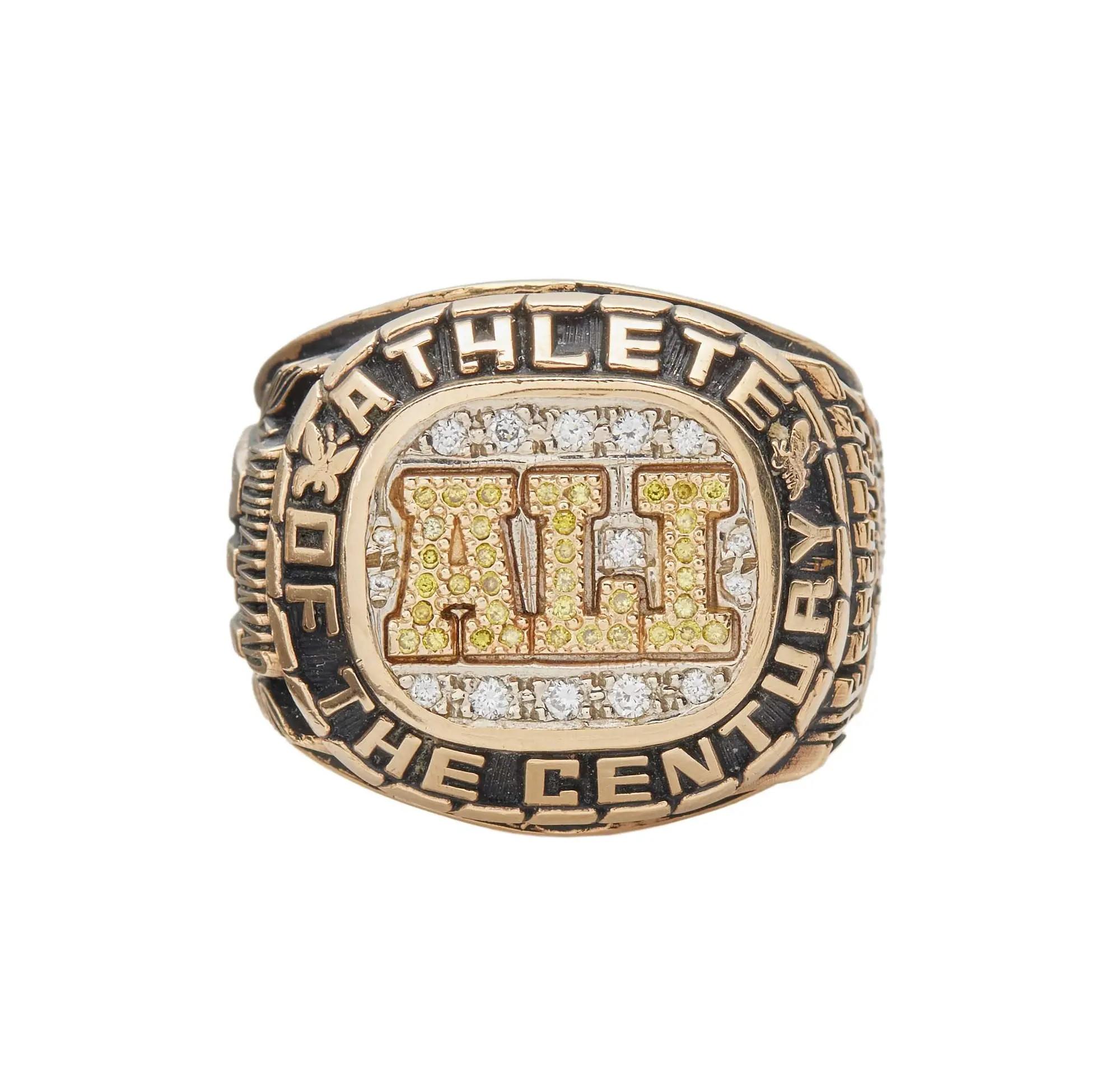 Lot #280  Jerry Weintraub Muhammad Ali Champion 14K Yellow Gold, Diamond, and Colored Diamond Ring