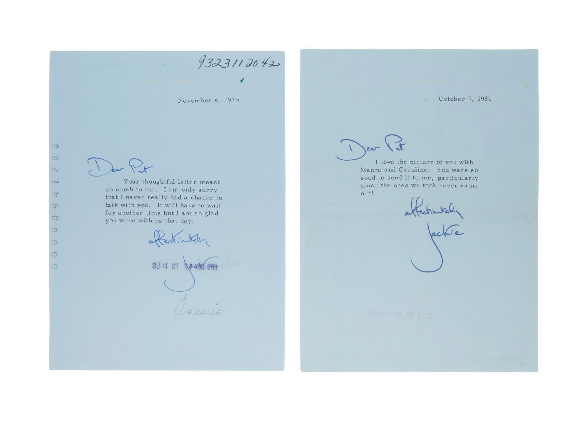 a couple of letters written by a person on a white background .
