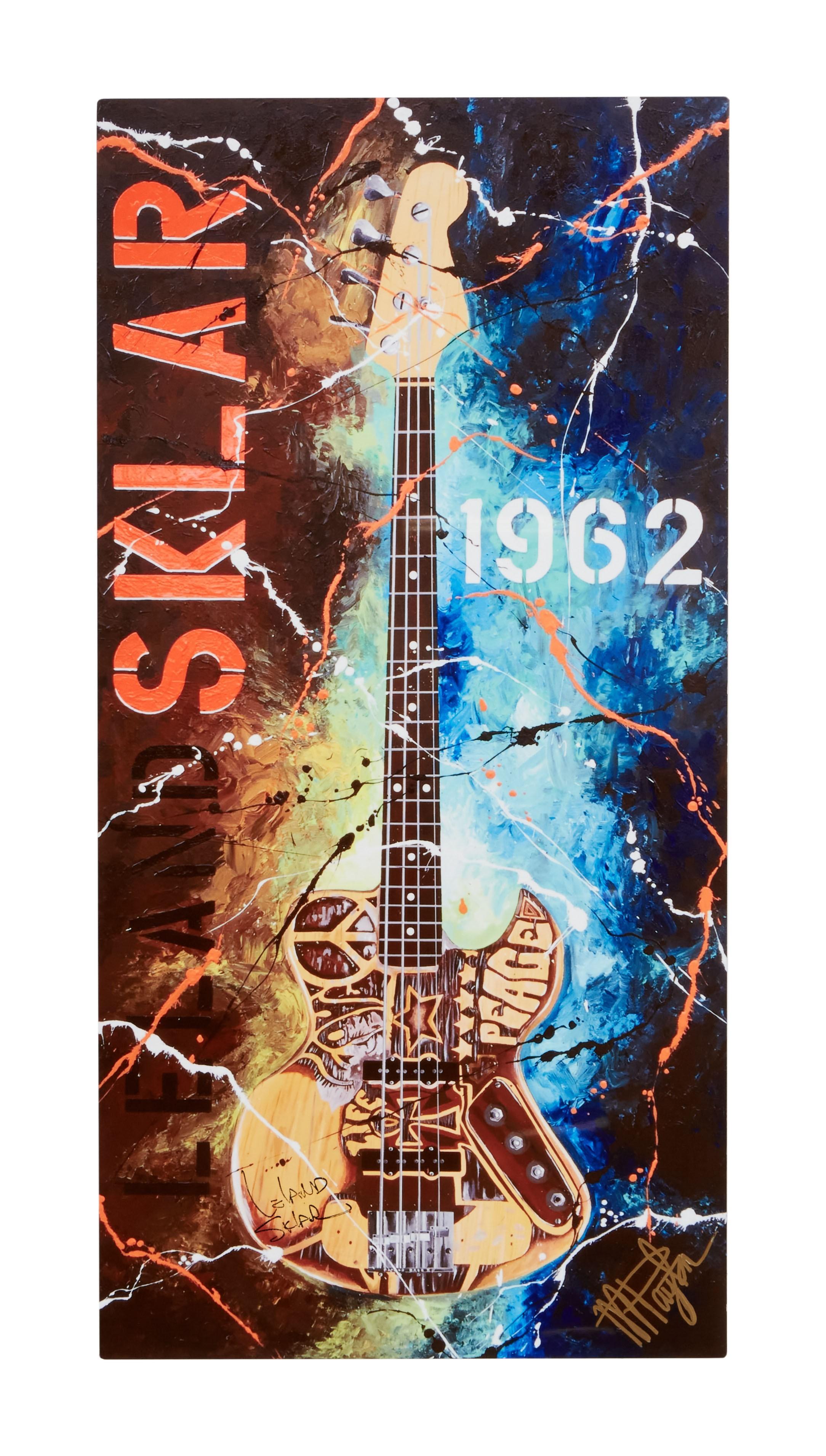 Leland Sklar | Signed "Hand Carved Bass" Metal Art Print with Photos Vibrant painting of a bass guitar with peace symbols and "LEO FENDER 1962" text against a splattered brown and blue background.