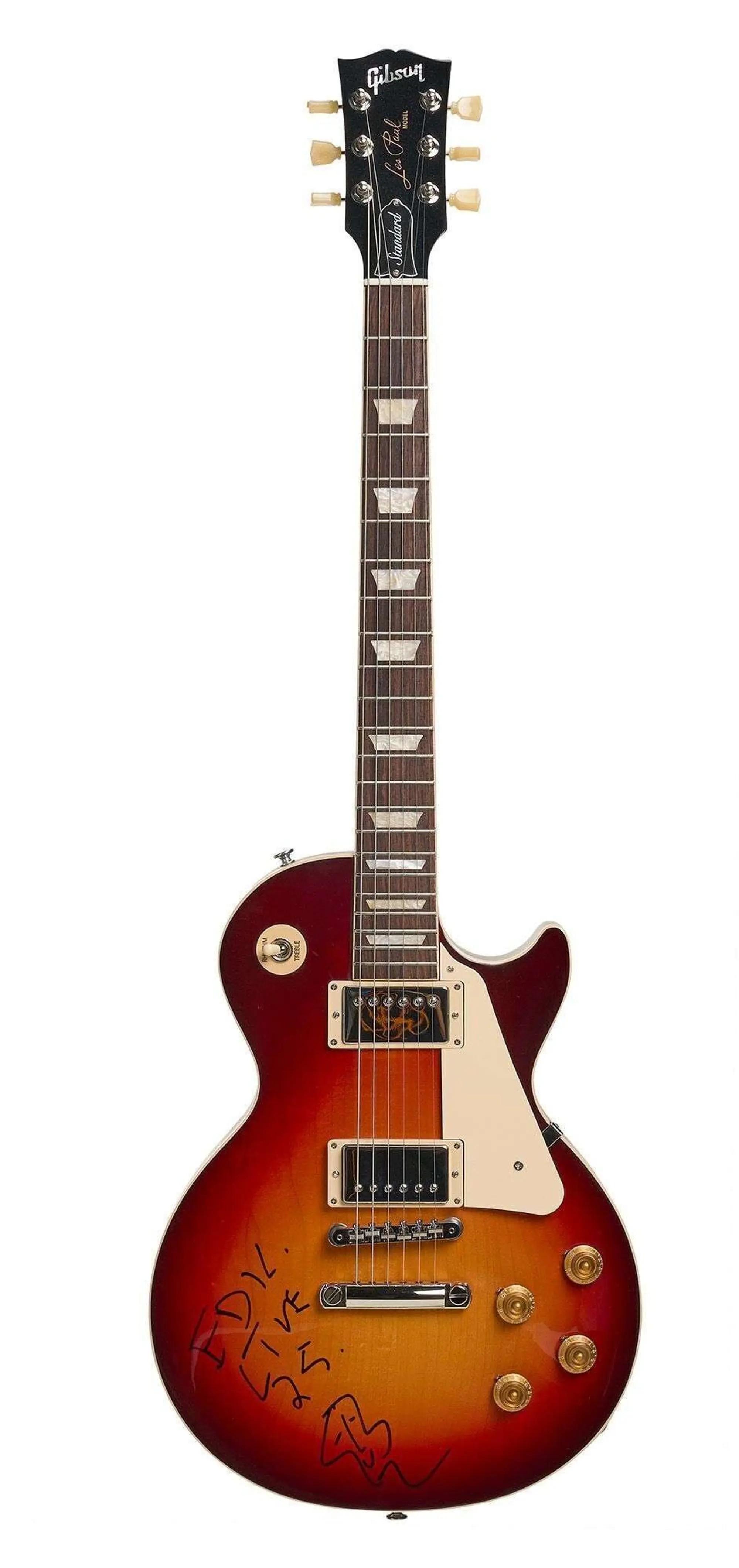 Lot #12. +Live+ | Ed Kowalczyk Signed Gibson Les Paul Standard ‘50s Plain Top Electric Guitar Dark Cherry Sunburst A sunburst Gibson Les Paul electric guitar with a cream pickguard, gold knobs, and a signature on its body.