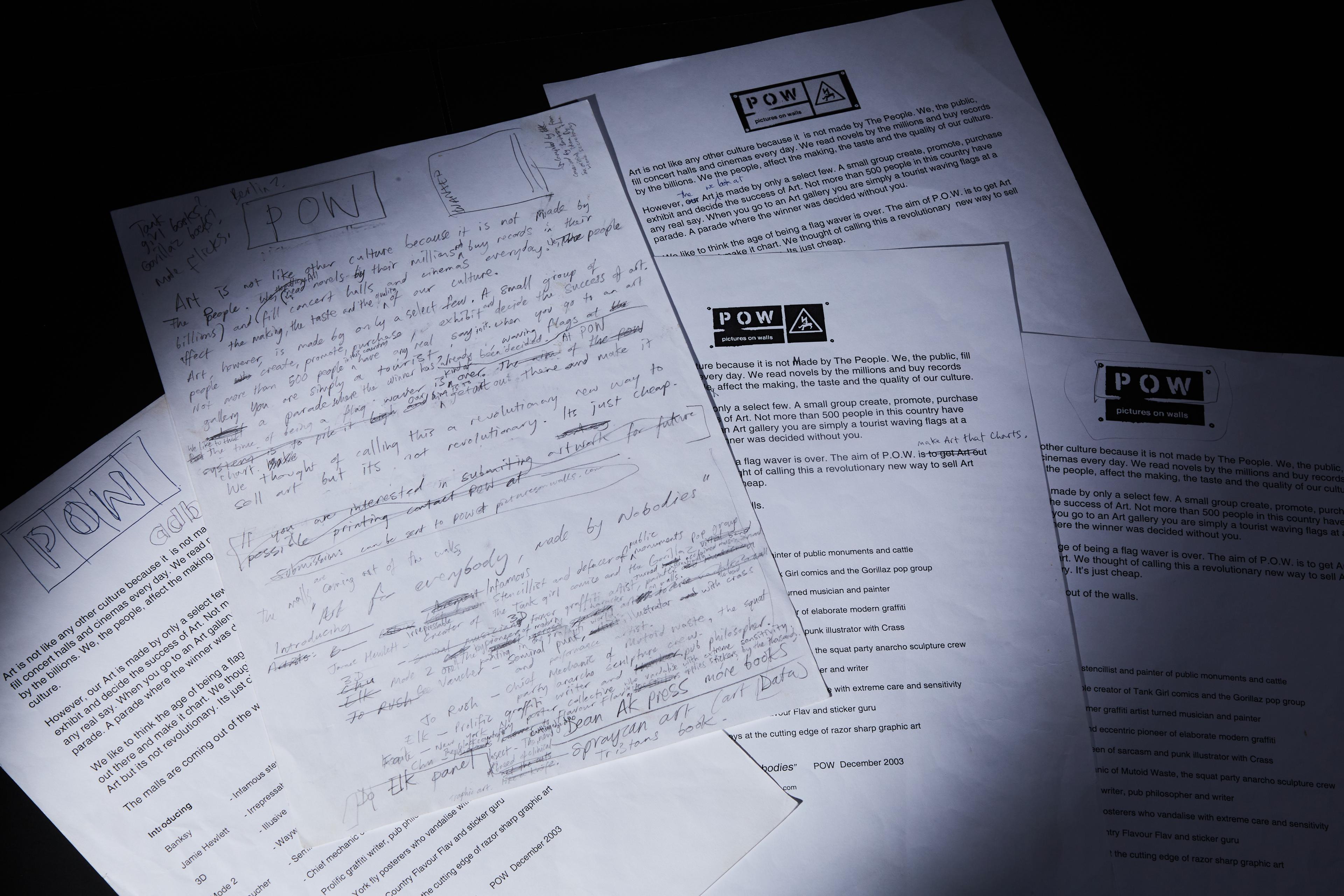 a bunch of papers are sitting on top of each other on a table .