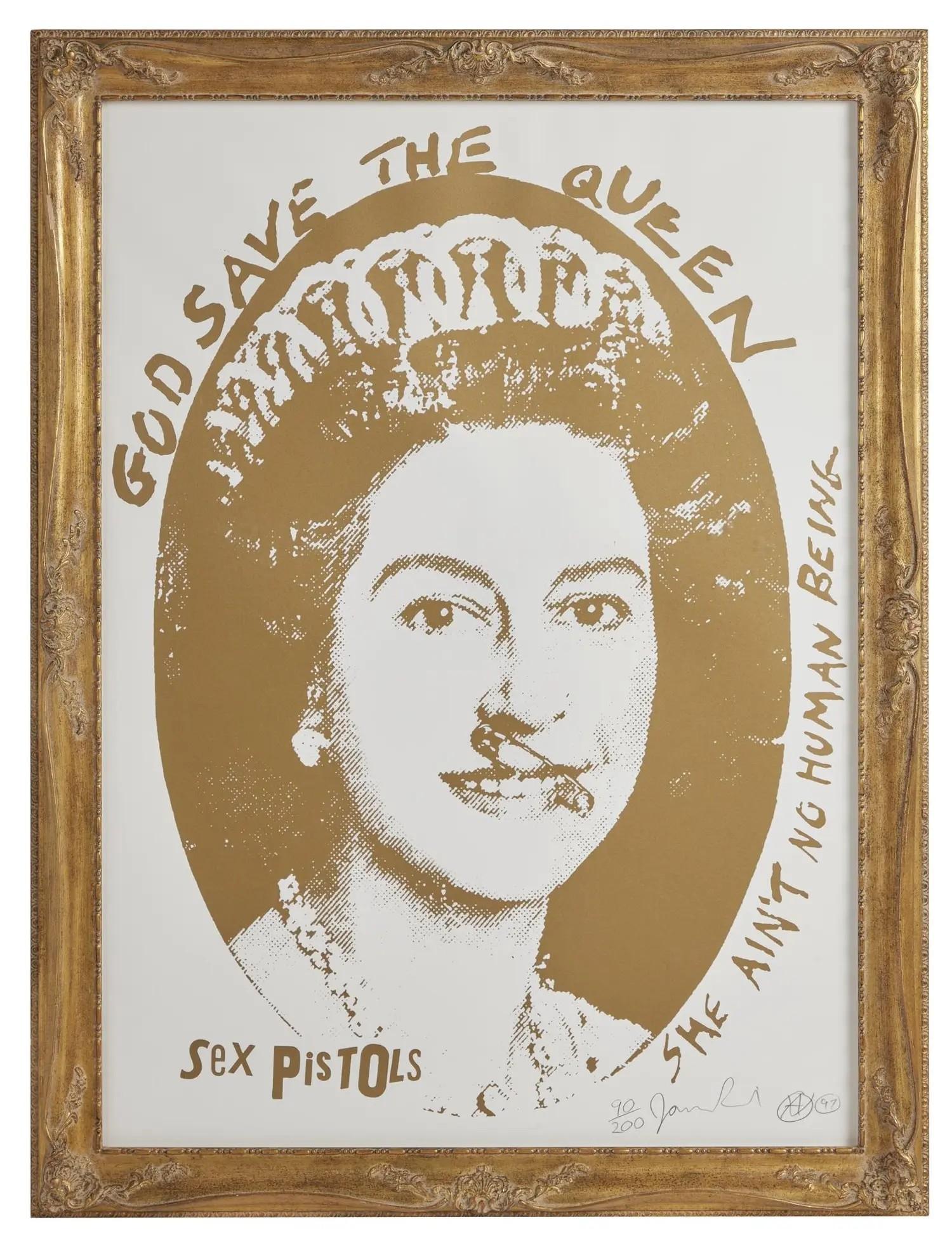 Lot #23. Jamie Reid | "Sex Pistols: God Save the Queen (Gold)" Signed Limited-Edition Screenprint A framed gold and white print depicting Queen Elizabeth II with a safety pin through her lip, and text reading 'GOD SAVE THE QUEEN', 'SHE AIN'T NO HUMAN BEING', and 'SEX PISTOLS'.