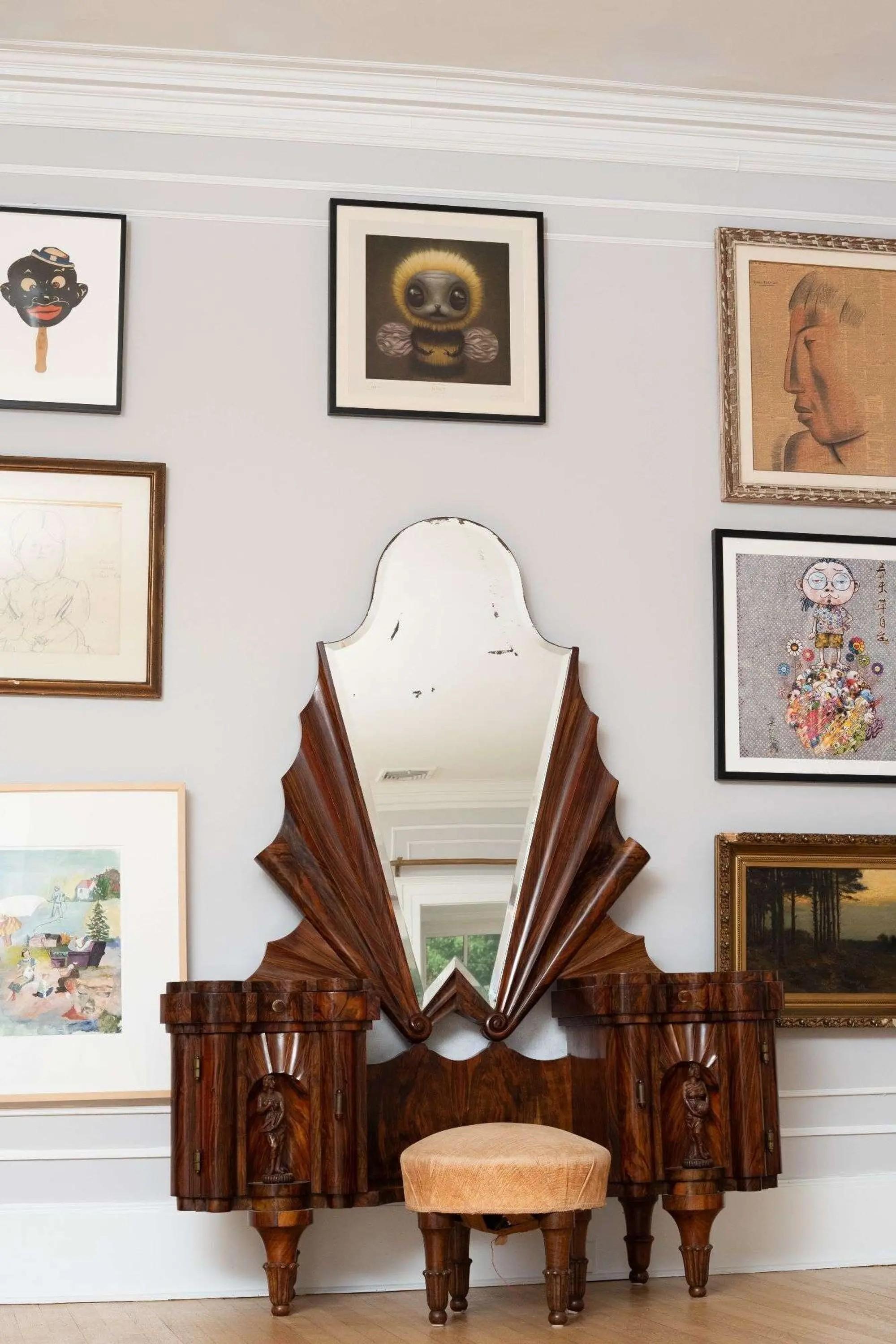 a brown piece of furniture with attached mirror