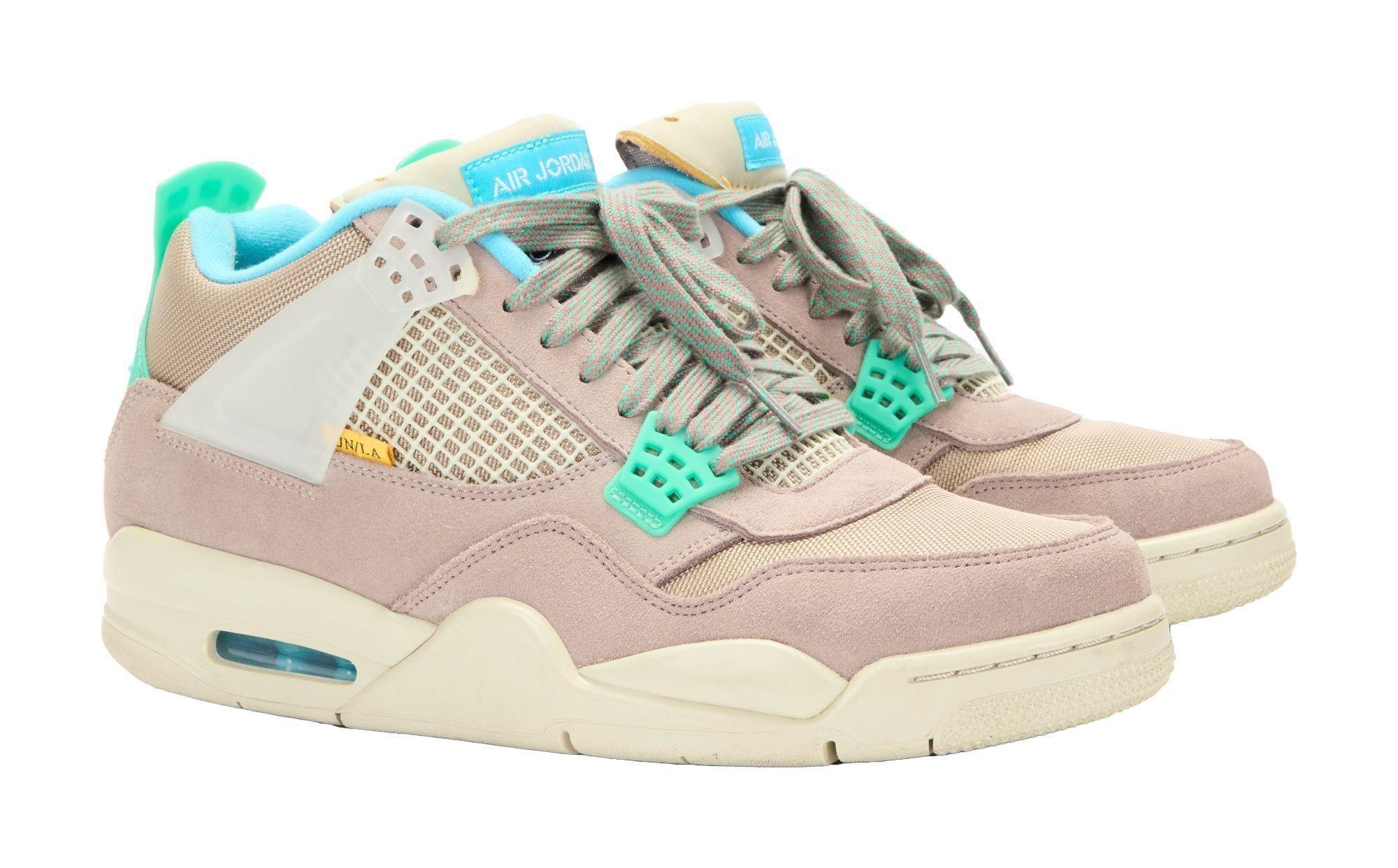 Lot #479. Angus Cloud | Jordan 4 Retro SP “30th Anniversary Union Taupe Haze” Sneakers a pair of pink and blue air jordan 4 sneakers on a white background .