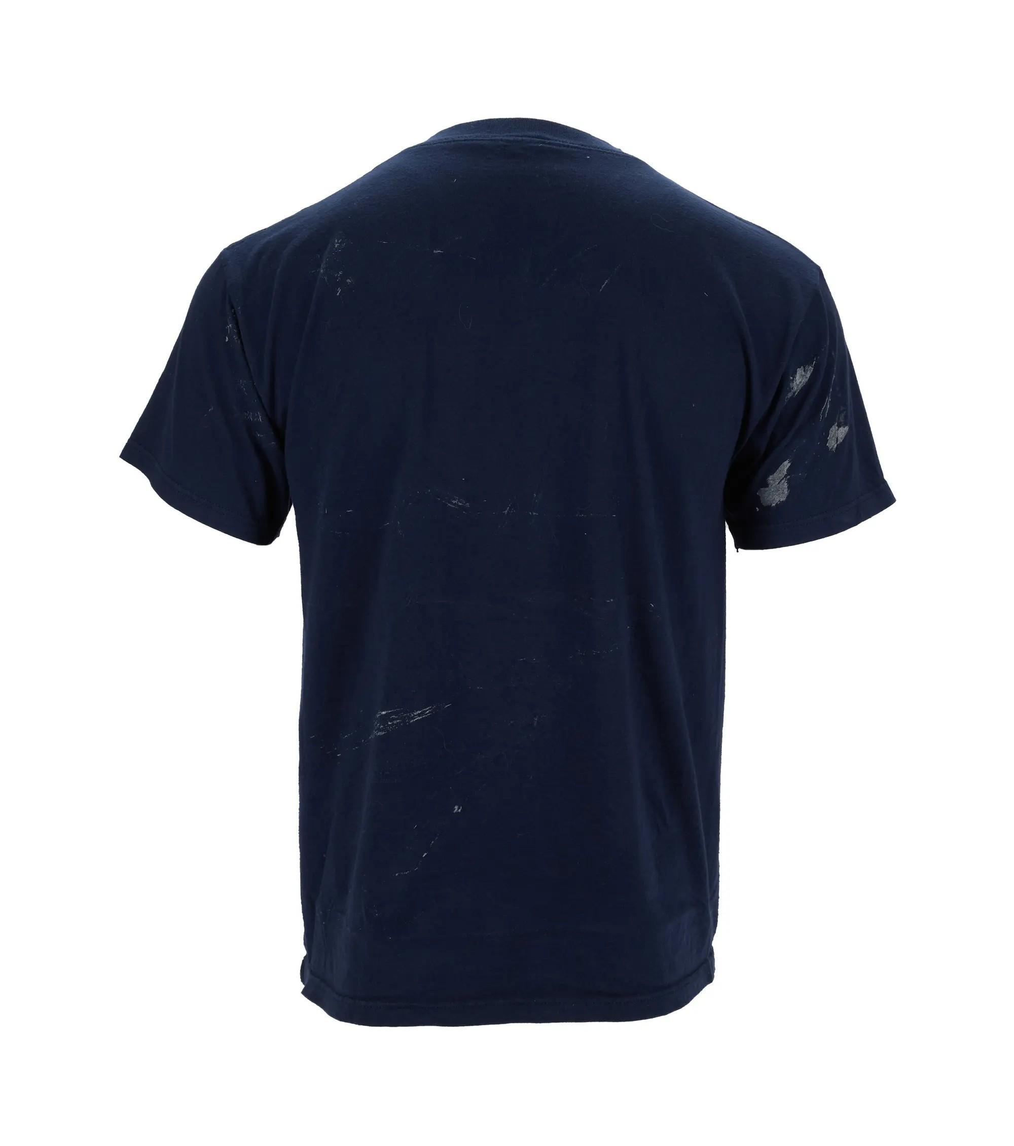 Back of a navy blue t-shirt with light paint splatters.