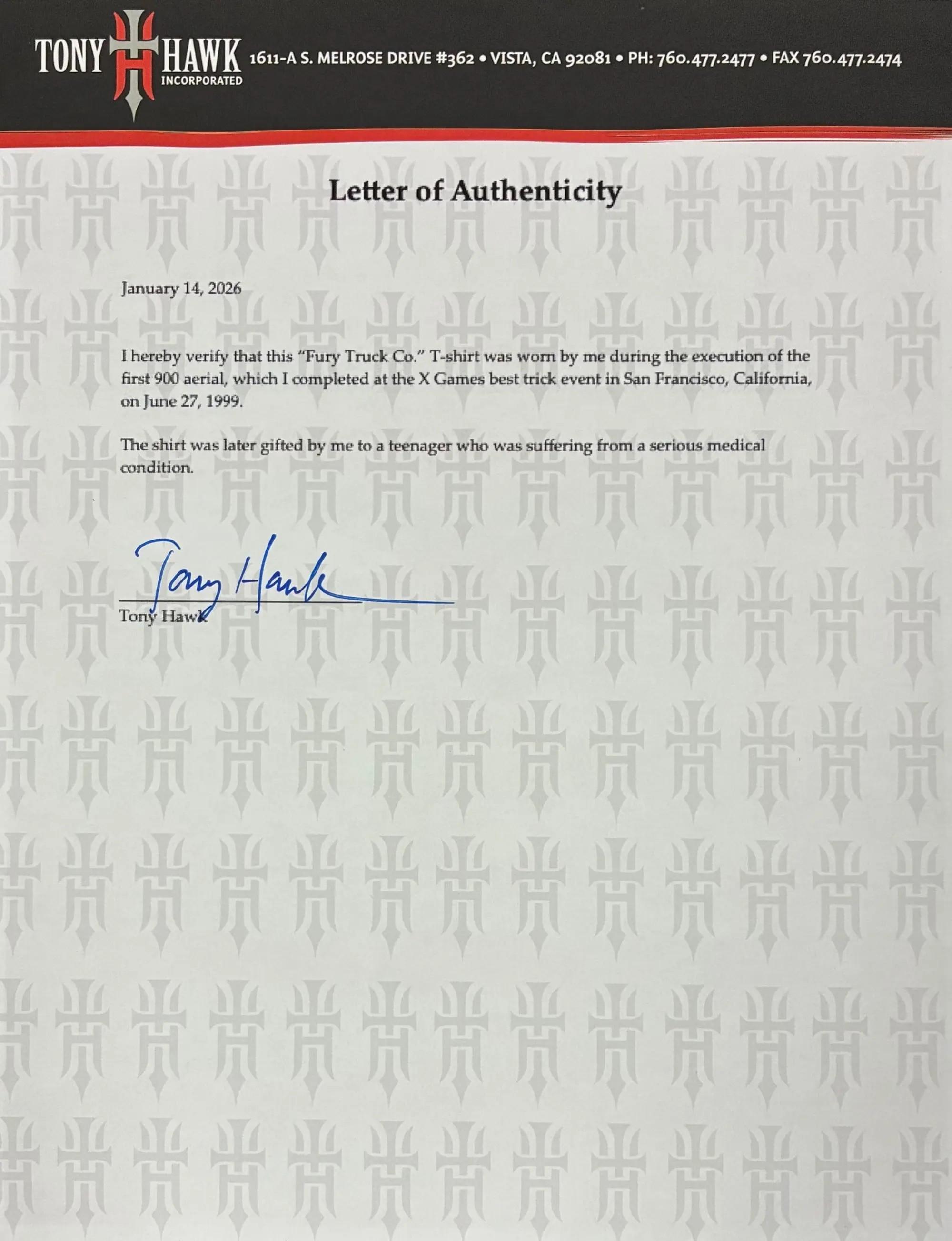 A letter of authenticity from Tony Hawk, dated January 14, 2026, verifying a "Fury Truck Co." T-shirt was worn during his first 900 aerial at the 1999 X Games and later gifted to a teenager, signed by Tony Hawk.