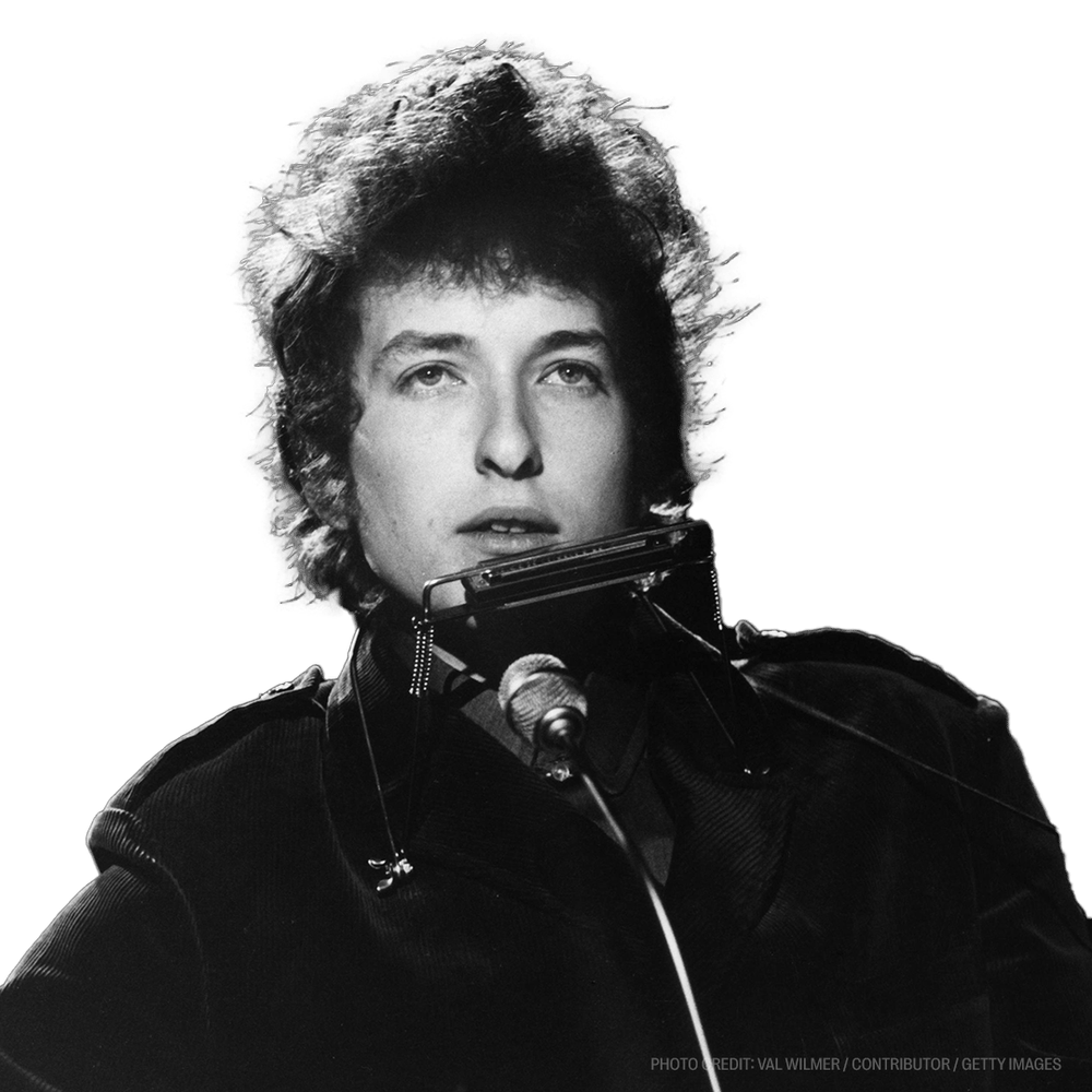 a black and white photo of a man singing into a microphone