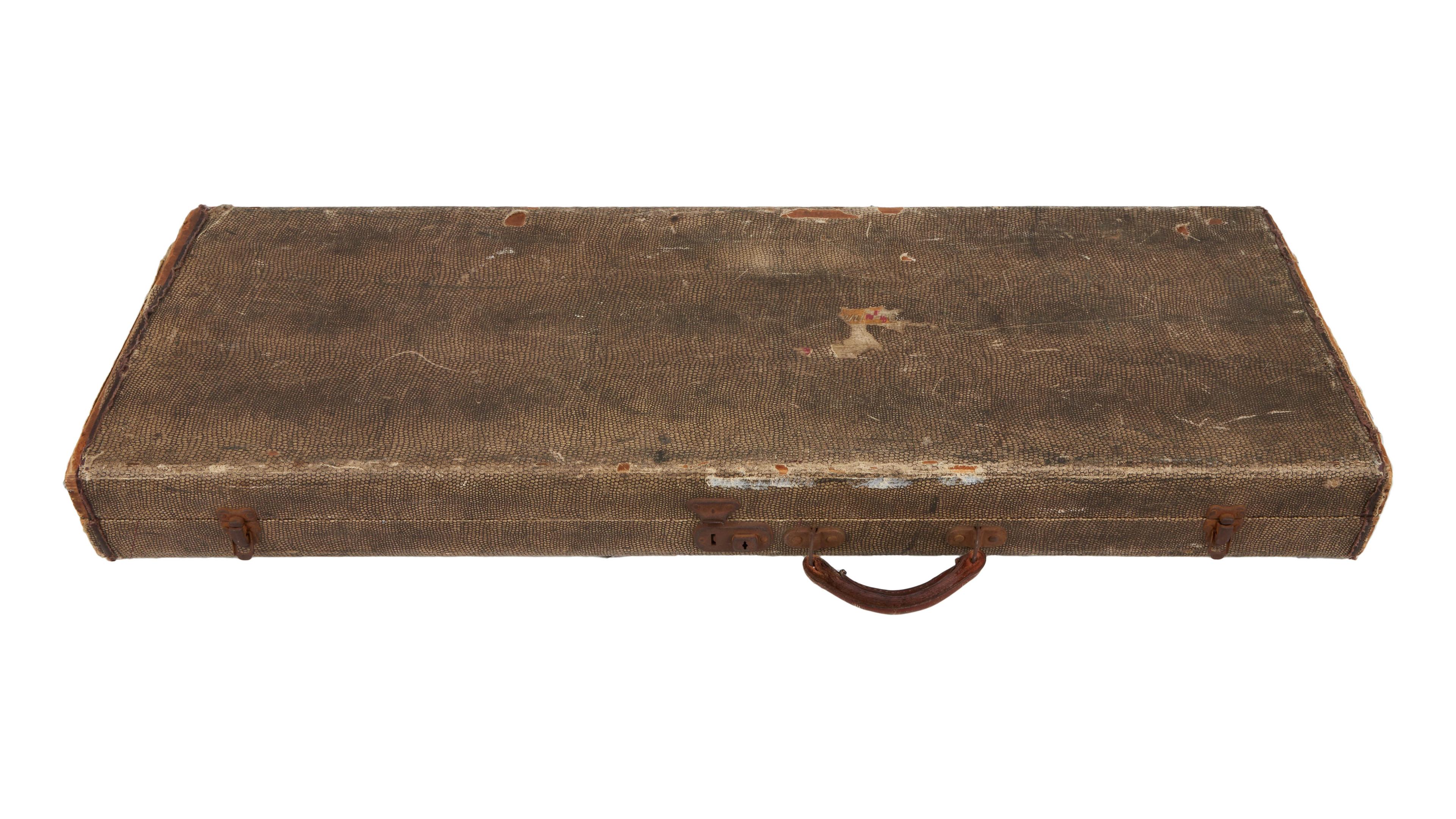 a brown leather case with a handle on a white background