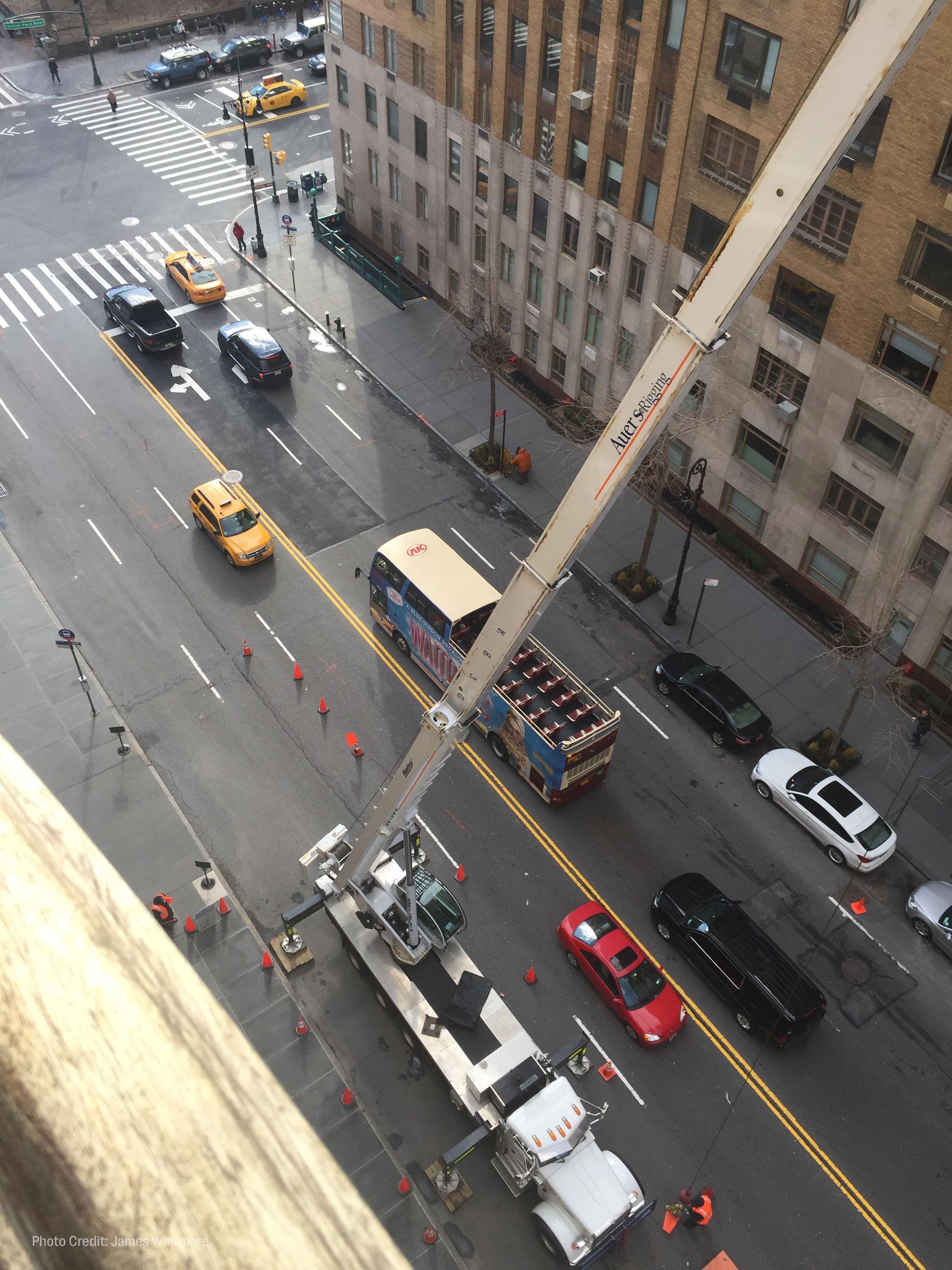 workers hoist roberta flack's piano out of her new york city apartment window.