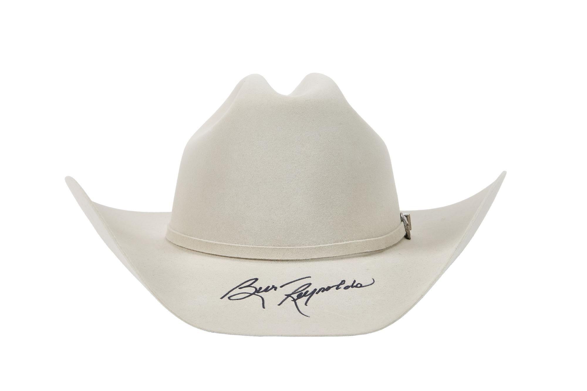 a white cowboy hat with a signature on it