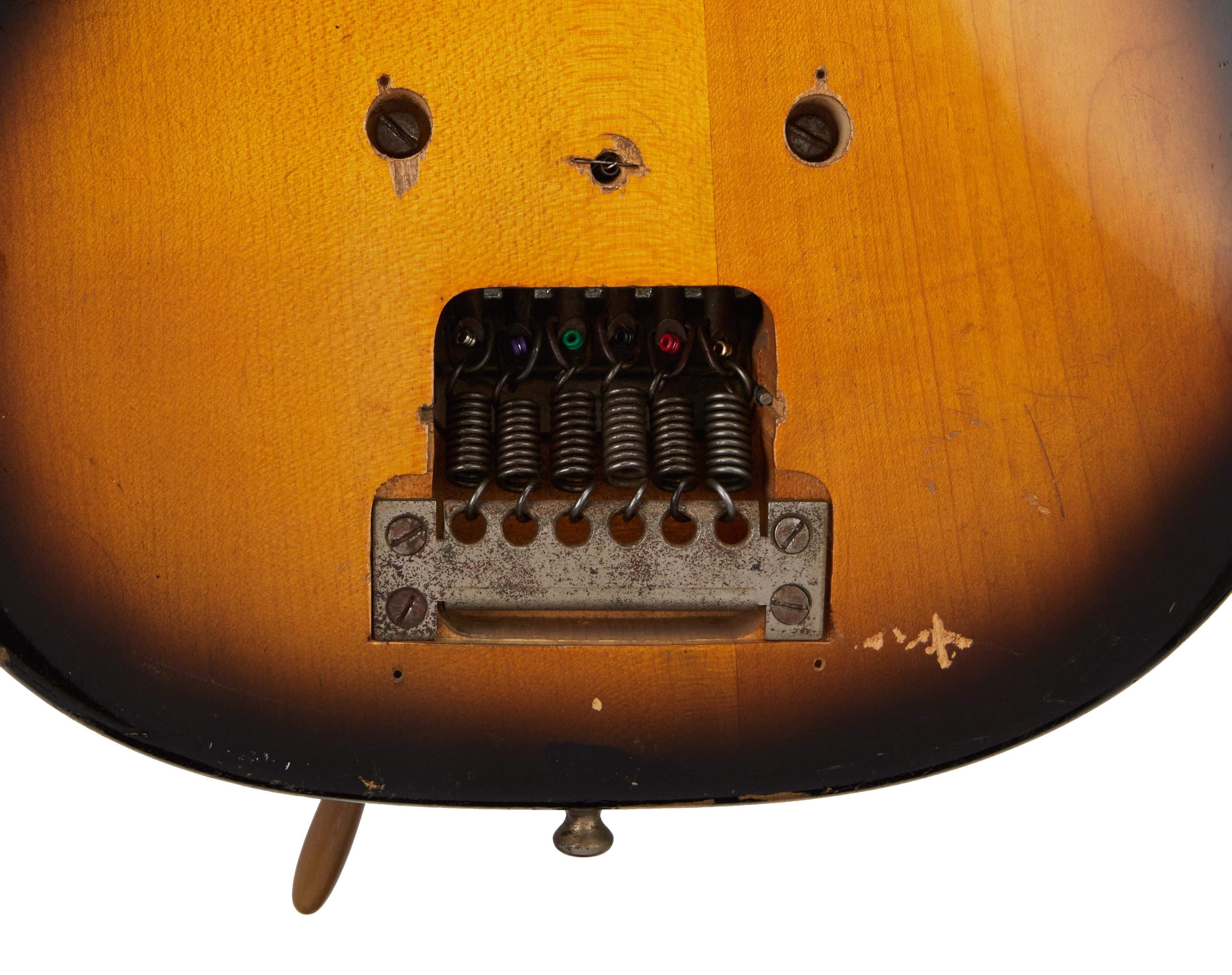 a close up of the back of a guitar on a white background .