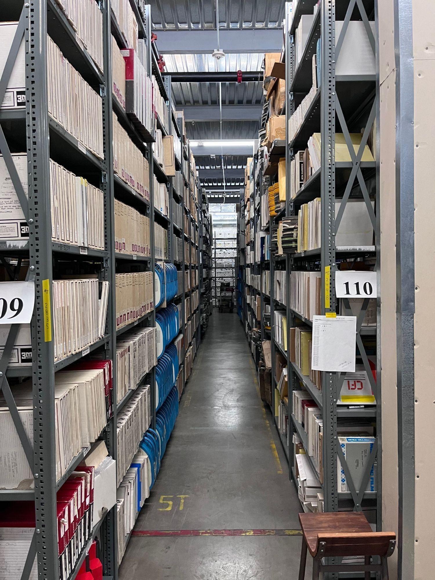 a warehouse with shelves labeled 110 and 09