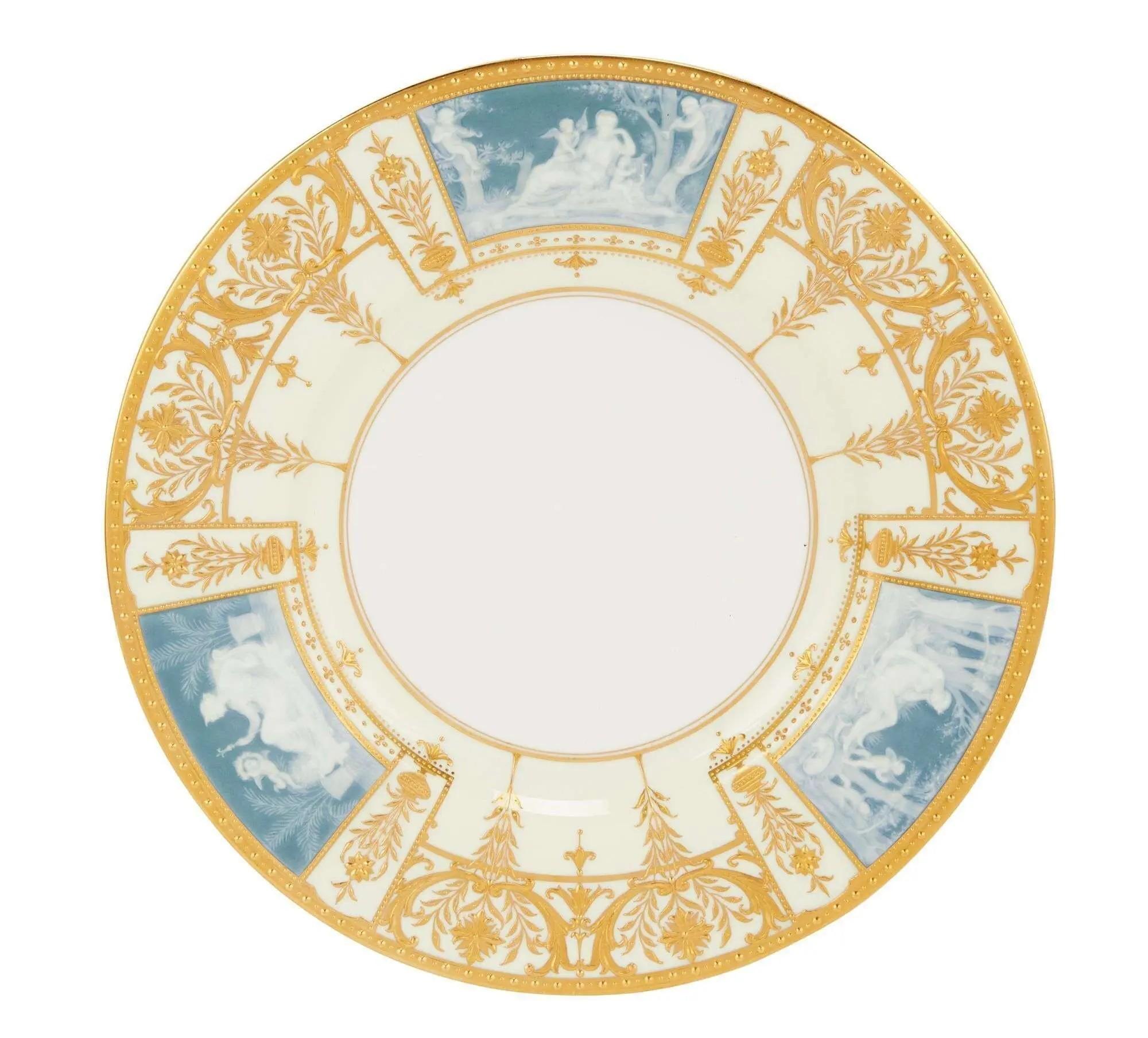 Lot #298. Whoopi Goldberg | 12 Mintons For Davis Collamore Pate-Sur-Pate Dinner Plates a blue white and gold dinner plate