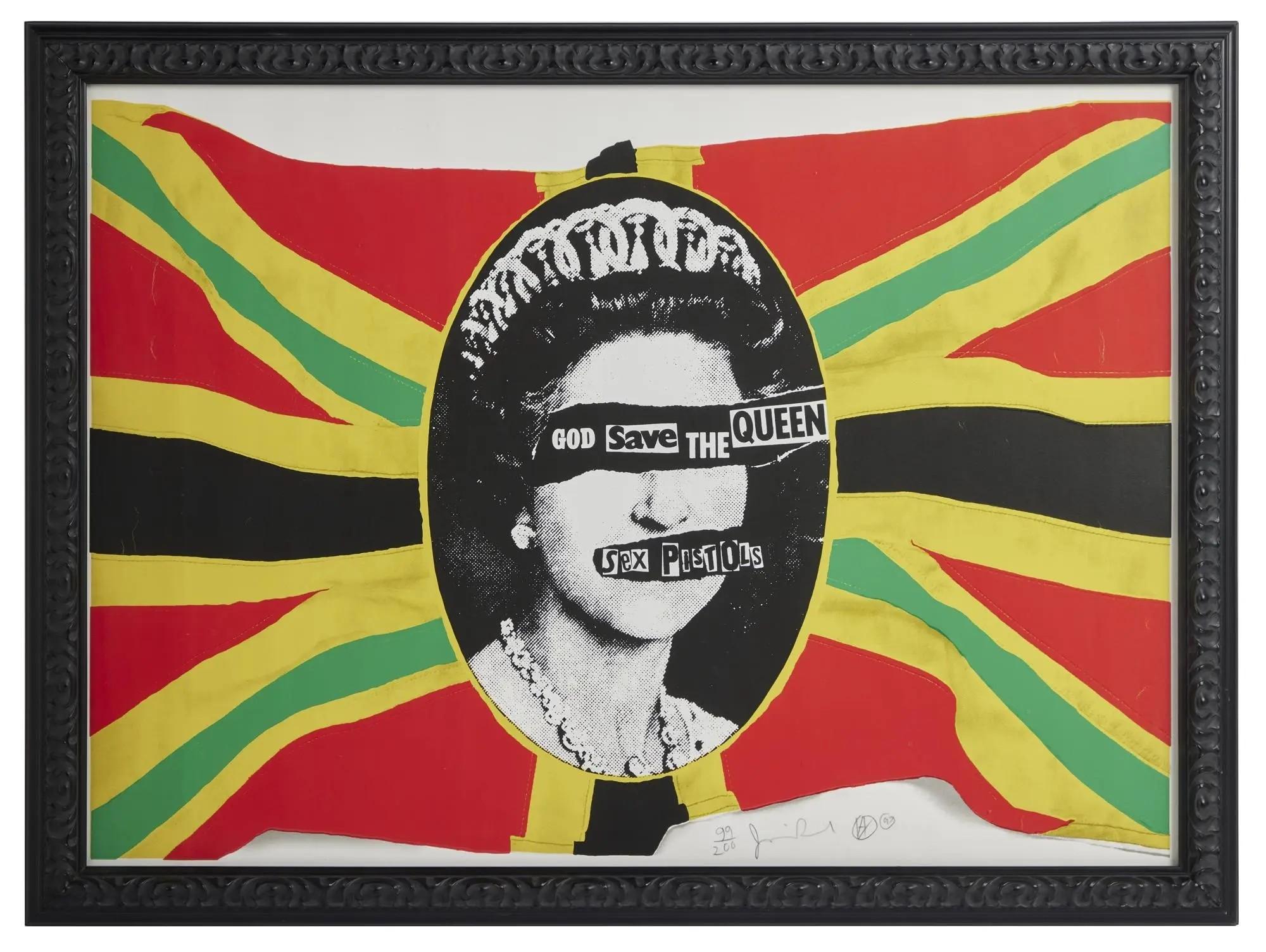 Framed artwork of Queen Elizabeth II with 'GOD Save THE QUEEN' across her eyes and 'SEX PISTOLS' across her mouth, on a red, yellow, and green Union Jack.
