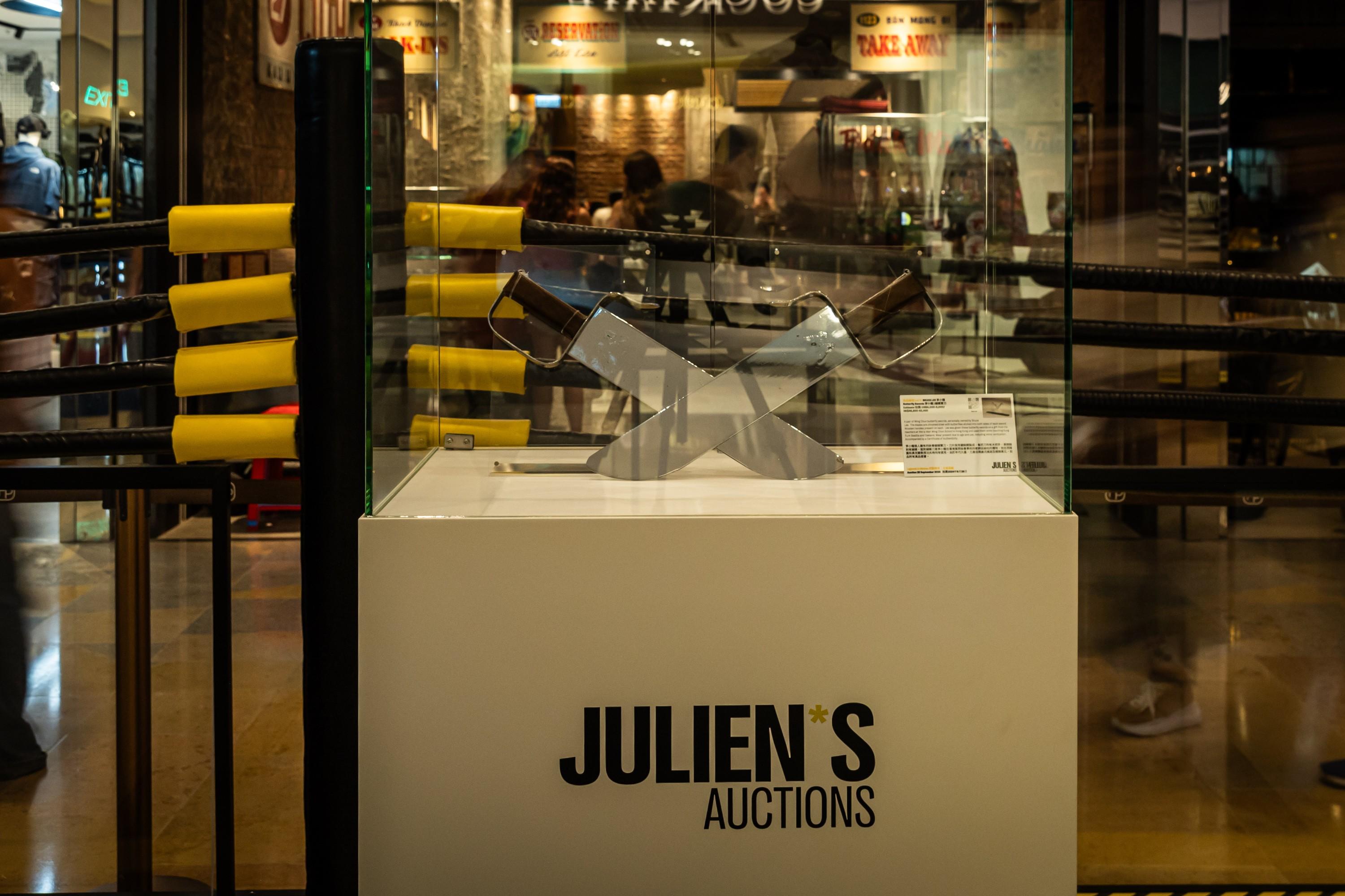 a display case for julien 's auctions in a store .