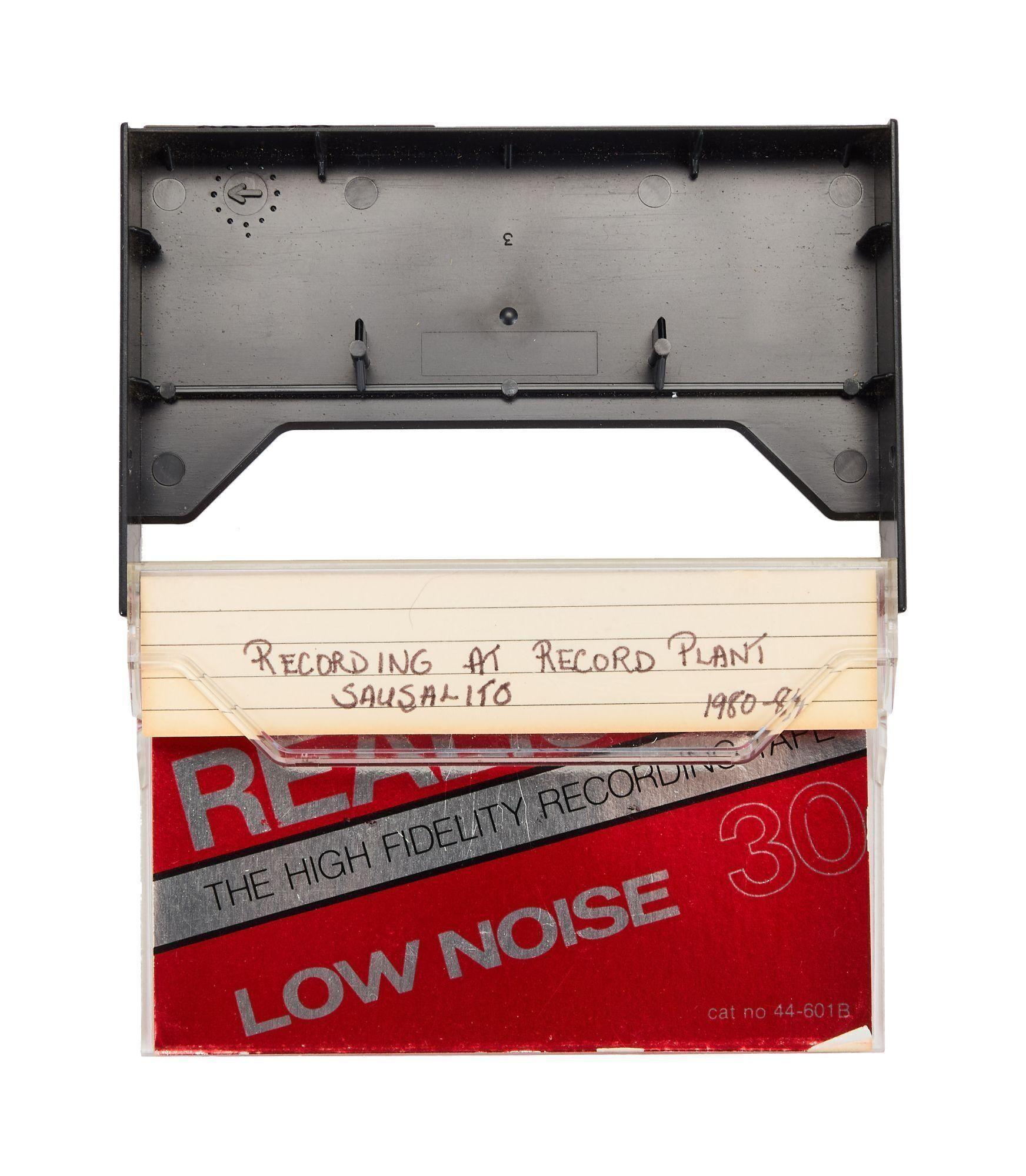 an open cassette case with writing on it