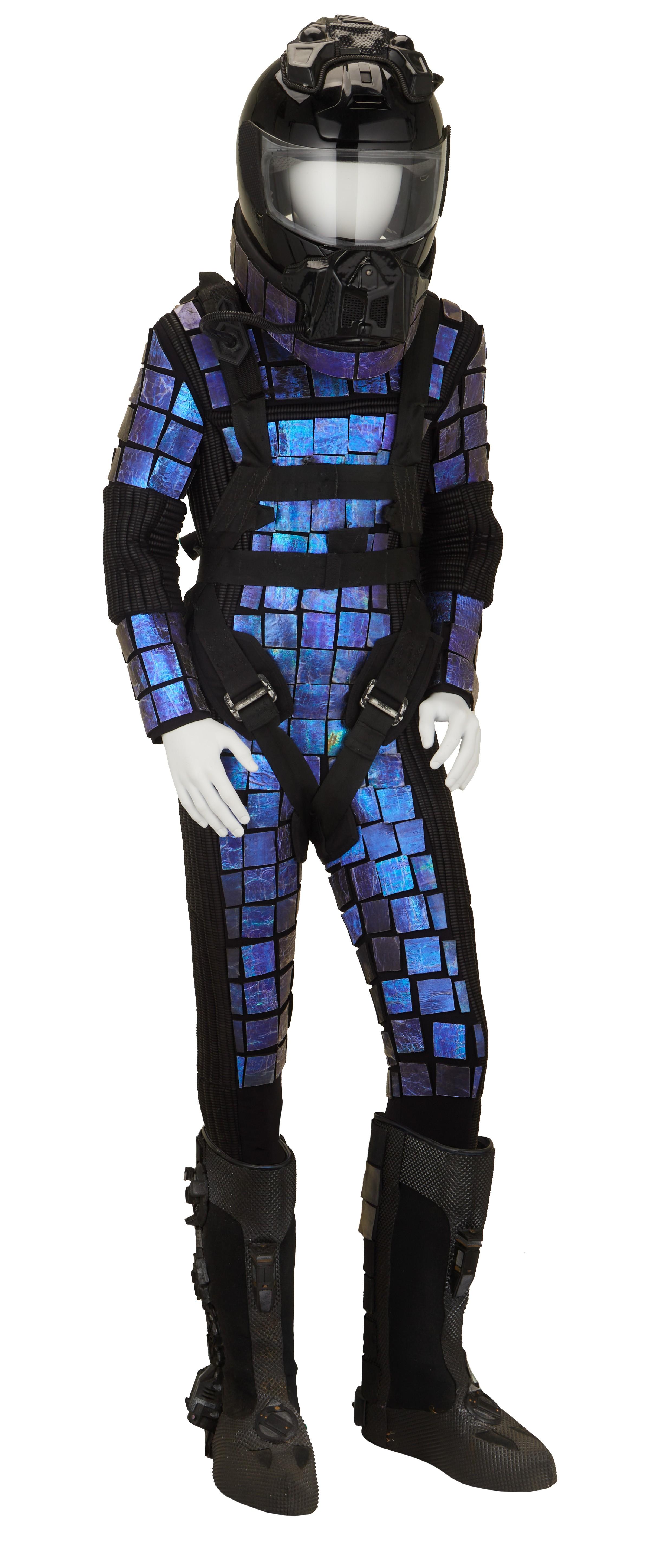 a mannequin wearing a black helmet and a blue space suit