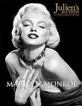 A black and white photo of Marilyn Monroe on a poster for Julien's Auctions