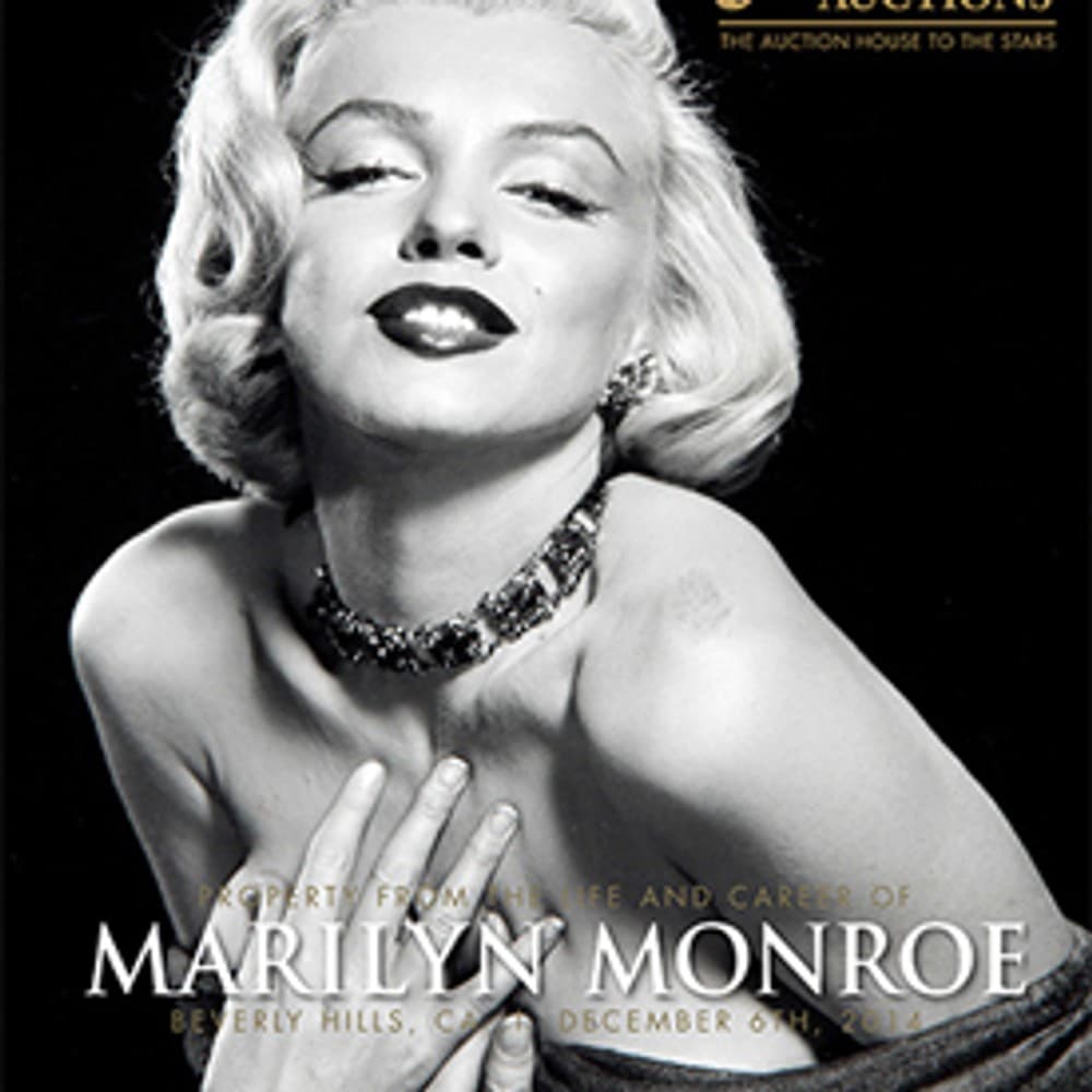 A black and white photo of Marilyn Monroe on a poster for Julien's Auctions