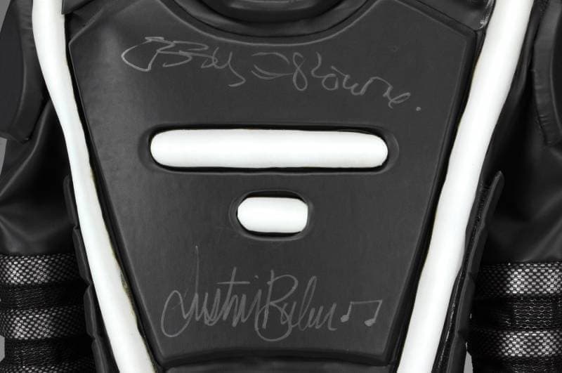 Black chest piece signed by Bobby Brown and Justin Bieber.
