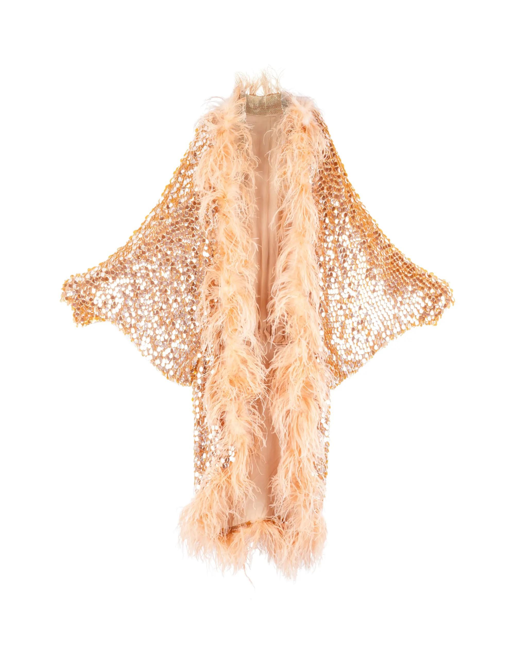 Lot #24 | Stage-Worn Beaded and Feathered Performing Coat with Photo Stage-Worn Beaded and Feathered Performing Coat with Photo