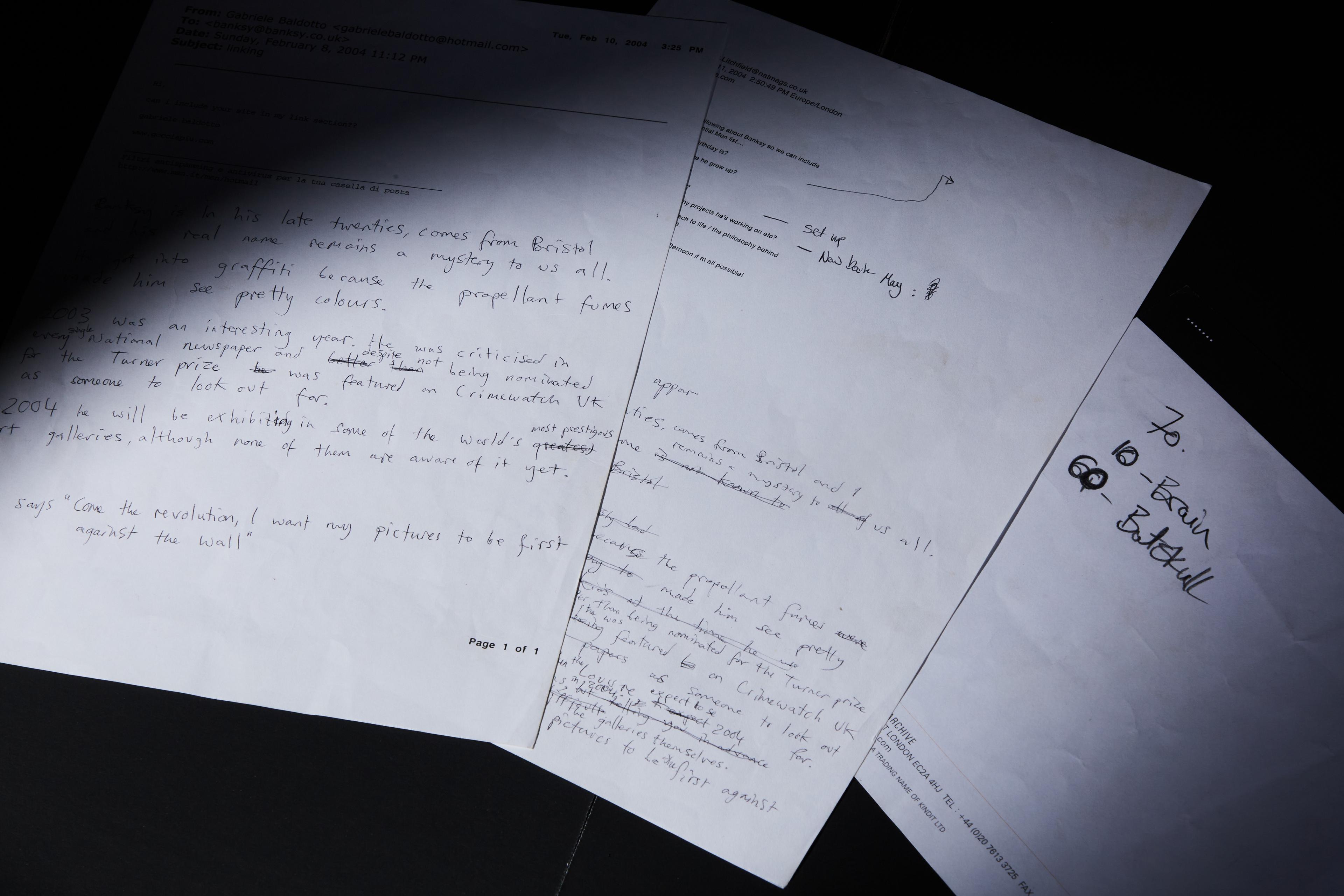 a bunch of papers are sitting on top of each other on a table .