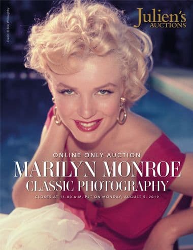 A poster for Julien's Auctions featuring Marilyn Monroe