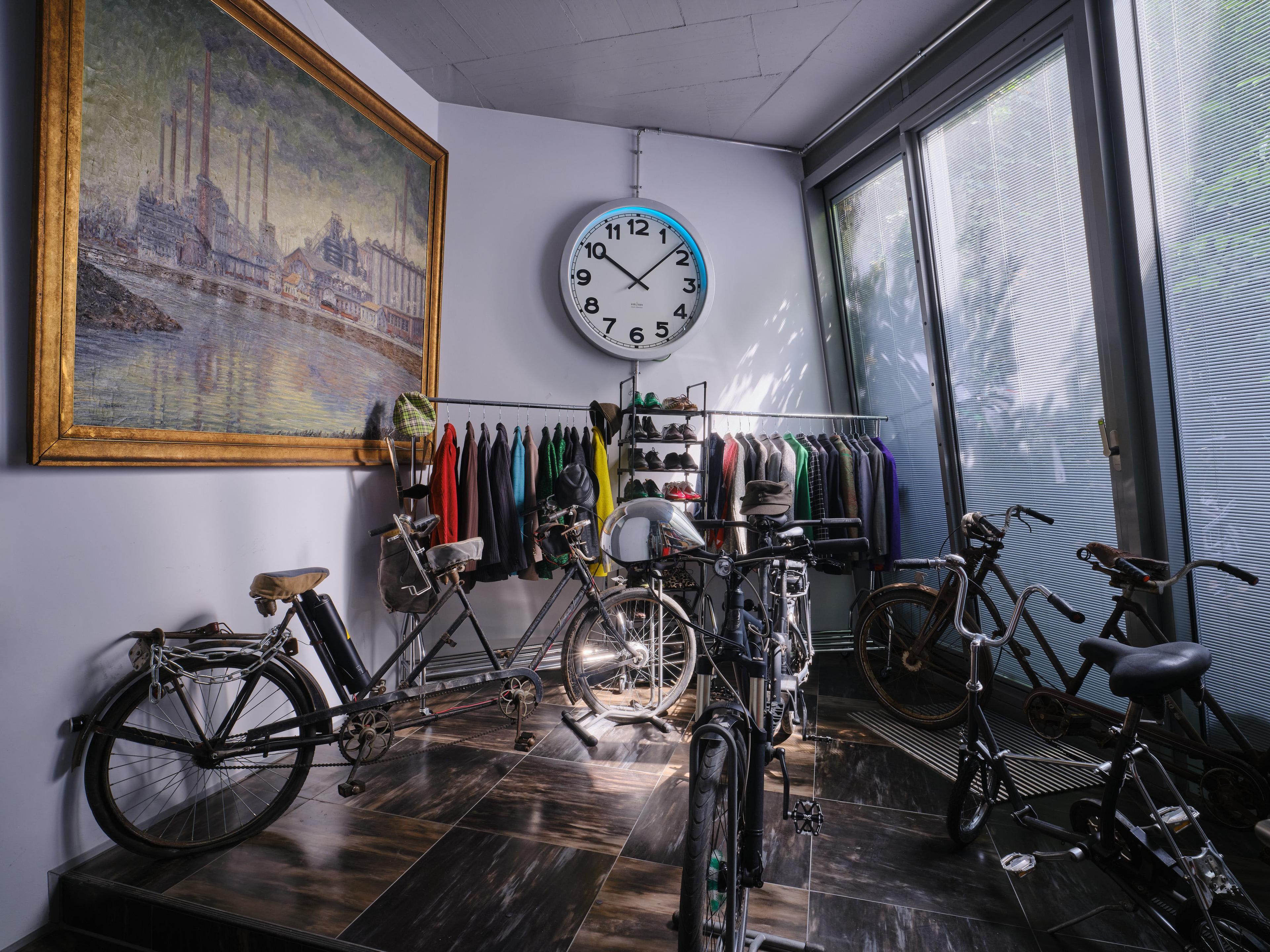 a picture a clock clothing and a crop of bikes from the collection of florian schneider